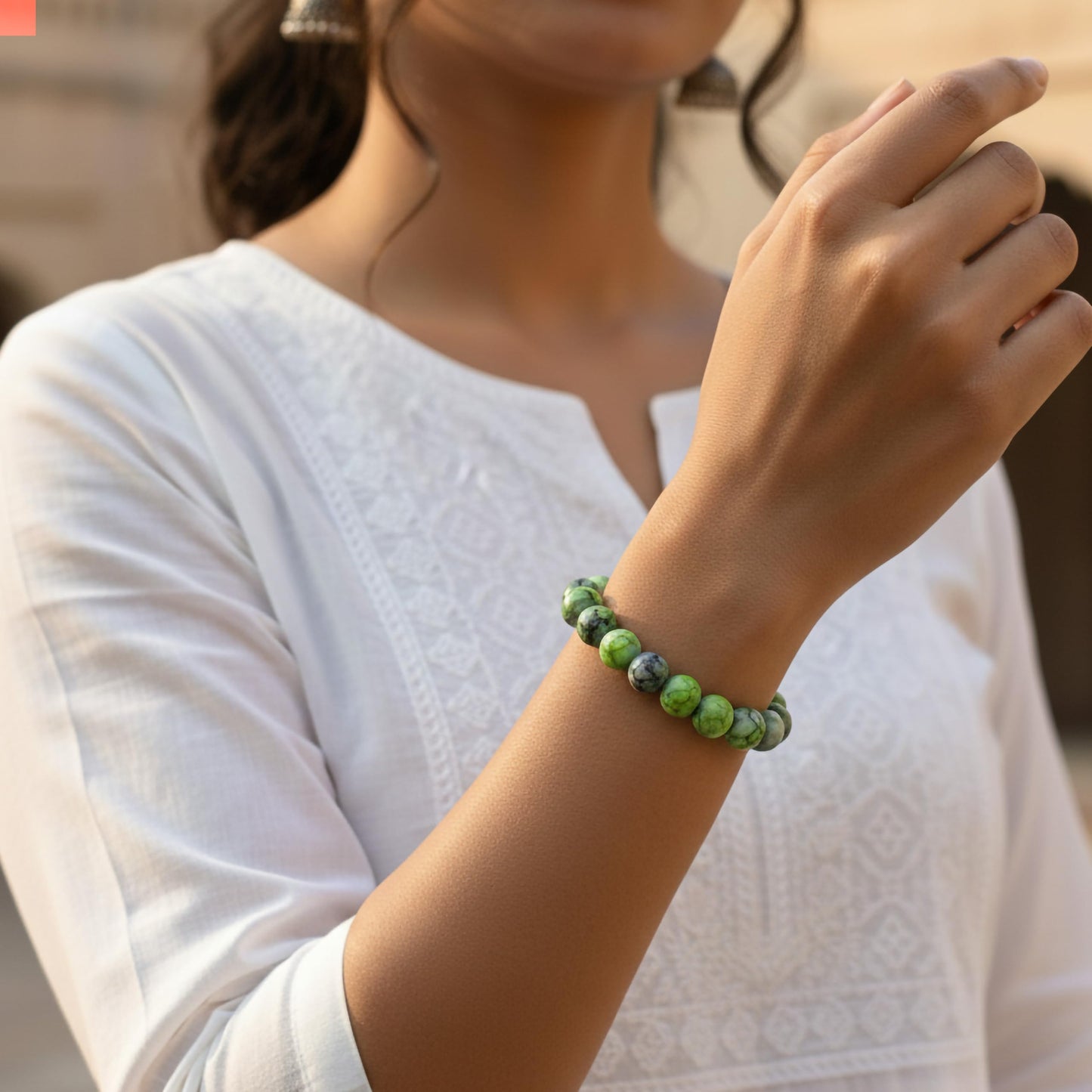 Style everyday outfits with a green and black bead bracelet that feels cute, light and easy to layer.