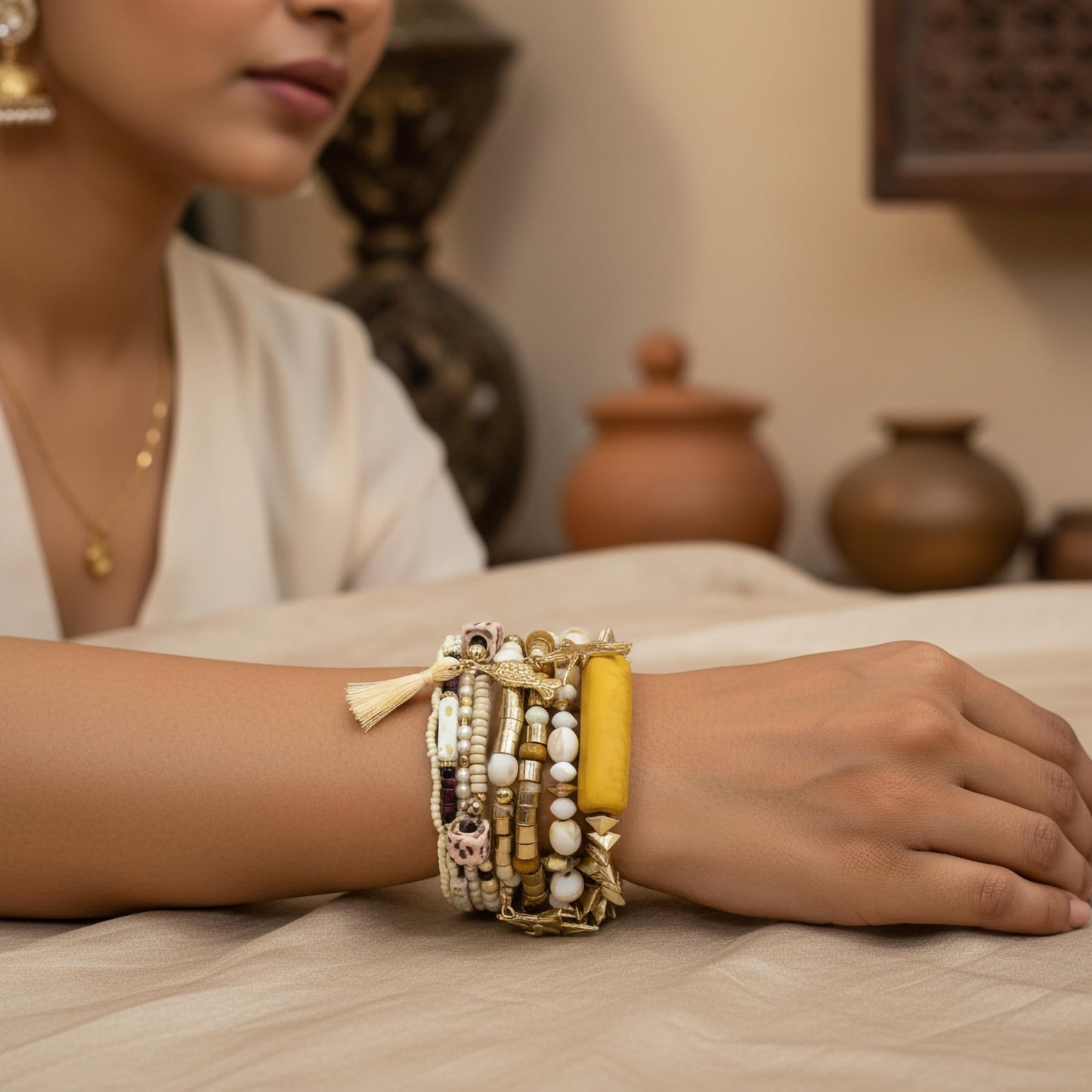 Make daily outfits feel more playful with a white boho bracelet set and beachy accents.