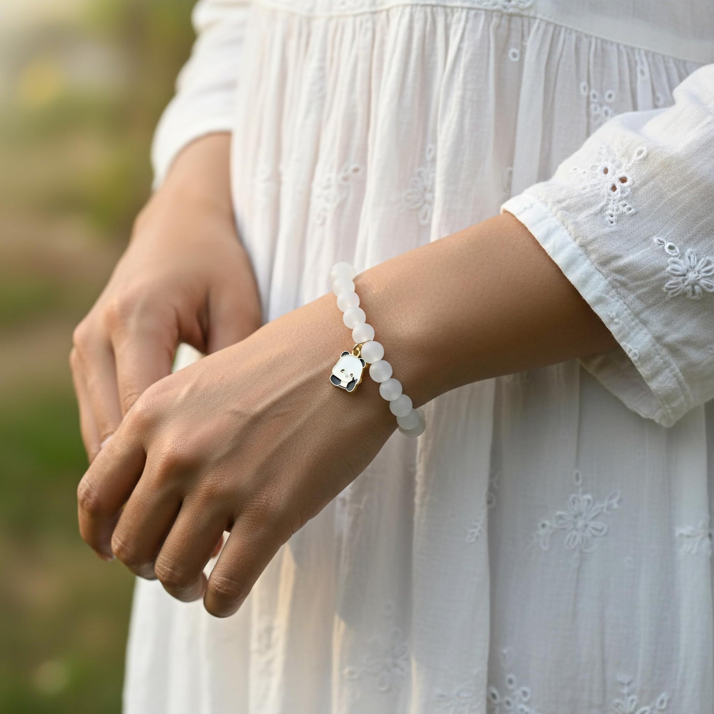 Make daily styling brighter with a white bead bracelet that feels simple and fun.