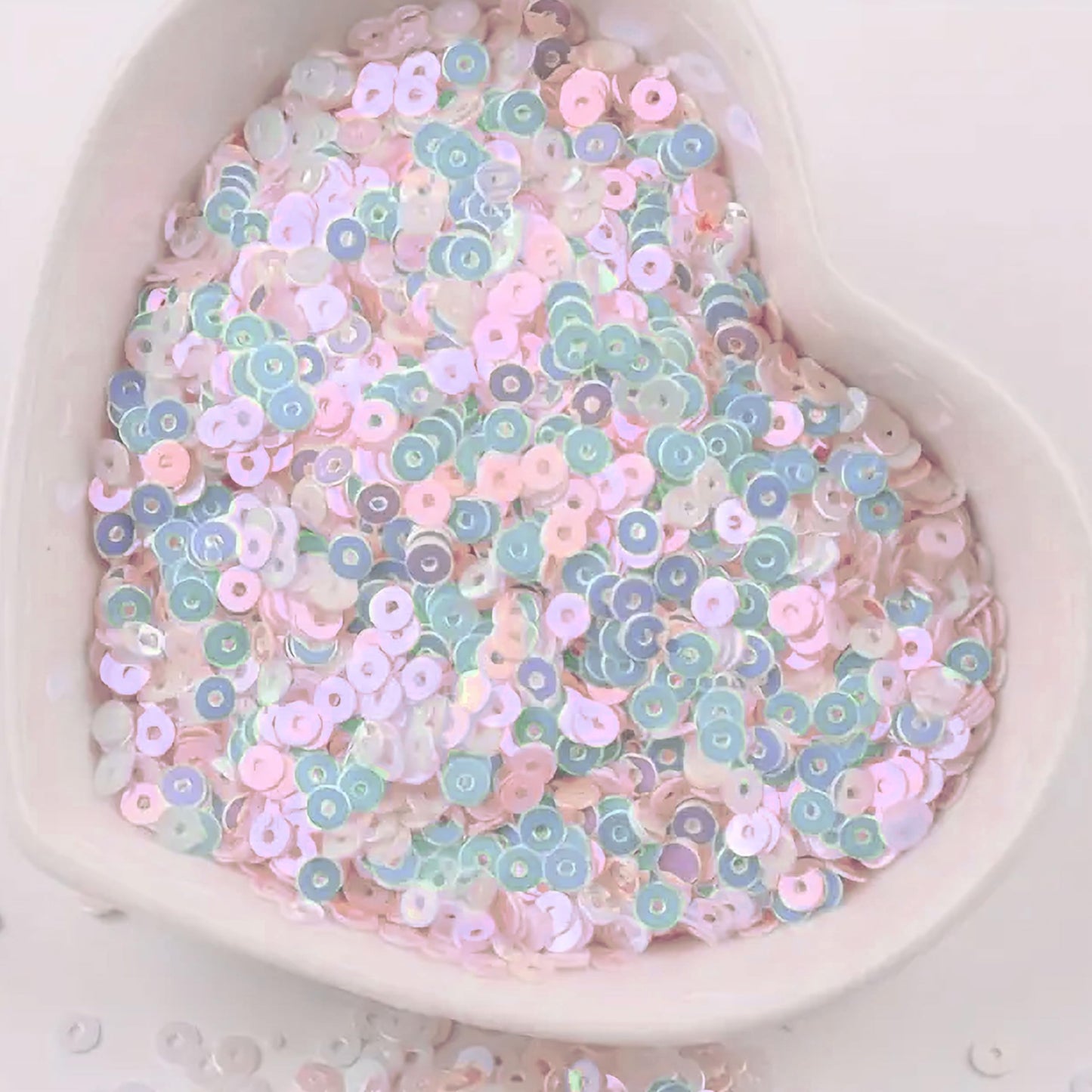 Embroidery for embroidery, craft decoration and fabric embellishment can be finished with pale pink 4mm sequins round shape 4mm sitara sequins with holes for sparkling look.