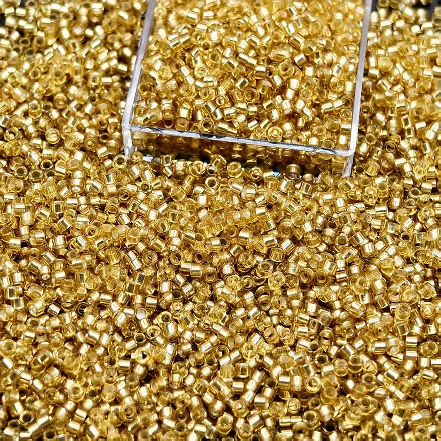 Light Gold Seed Beads 110 Silverline Finish Glass. Main product image showing the full assortment for jewelry making and craft work.