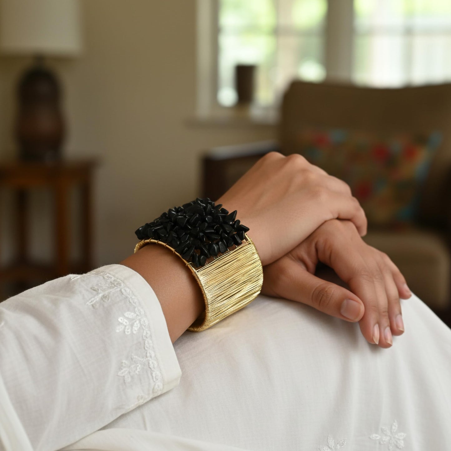 Give casual accessories a polished edge with a black open cuff bracelet and stone detail.