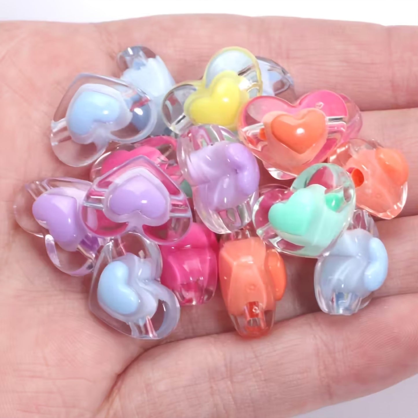 Multicolor Transparent Acrylic Heart Beads with Inner Crystal. Assorted layout image showing beads organized for bracelet and DIY projects.