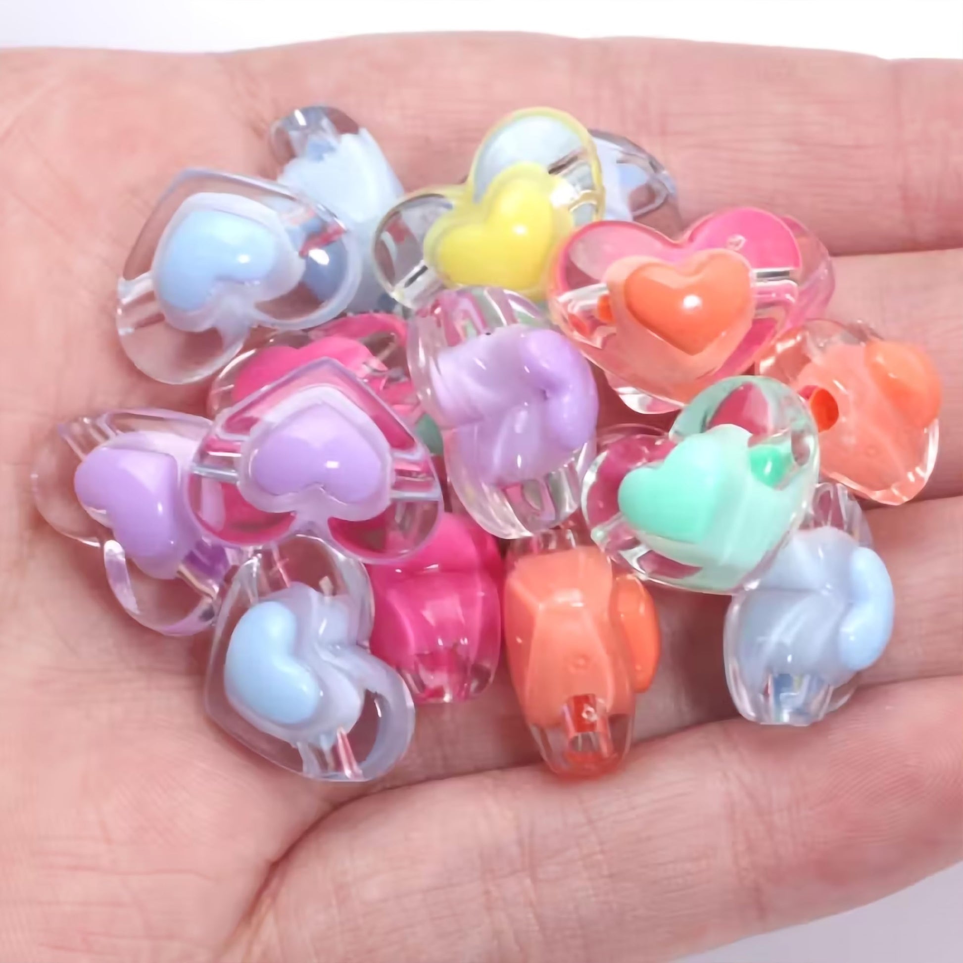 Multicolor Transparent Acrylic Heart Beads with Inner Crystal. Assorted layout image showing beads organized for bracelet and DIY projects.