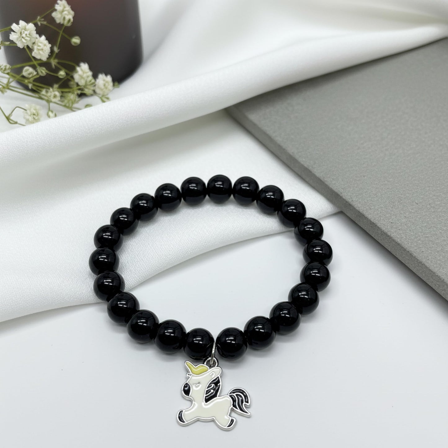 Gift a light and cheerful bracelet style with black beads and comfortable elastic wear.
