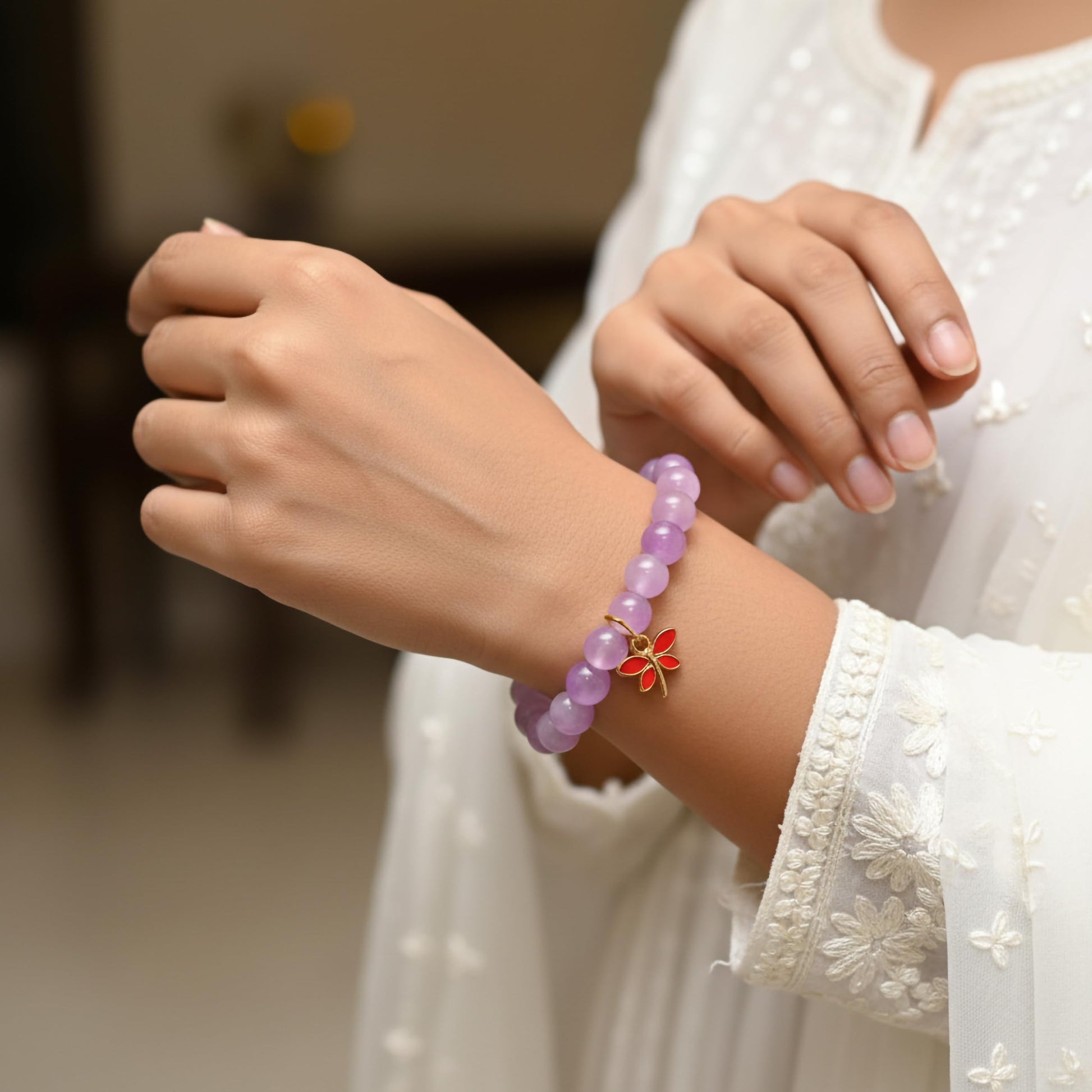 Create a playful accessory look using lavender dualtone beads and cute bracelet charms.