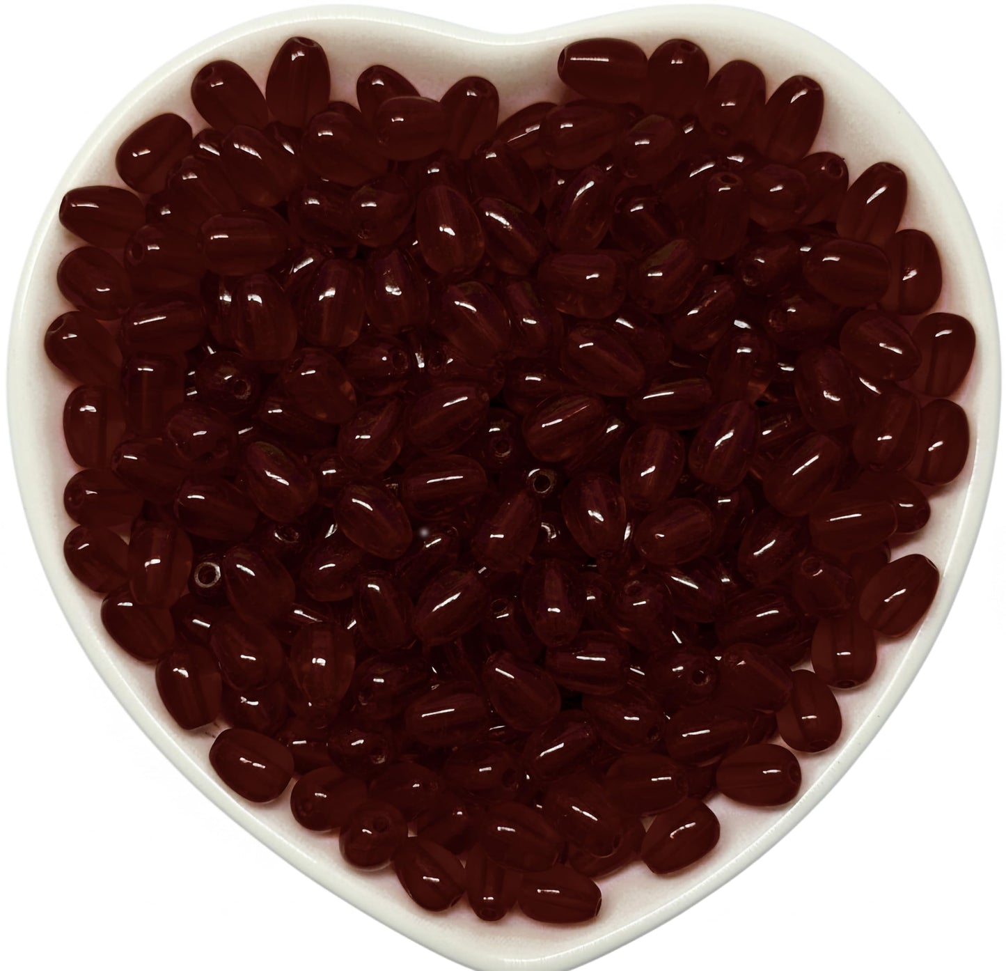 Use these 8x5mm maroon glossy assorted drop beads to make saree kuchu work feel more finished.