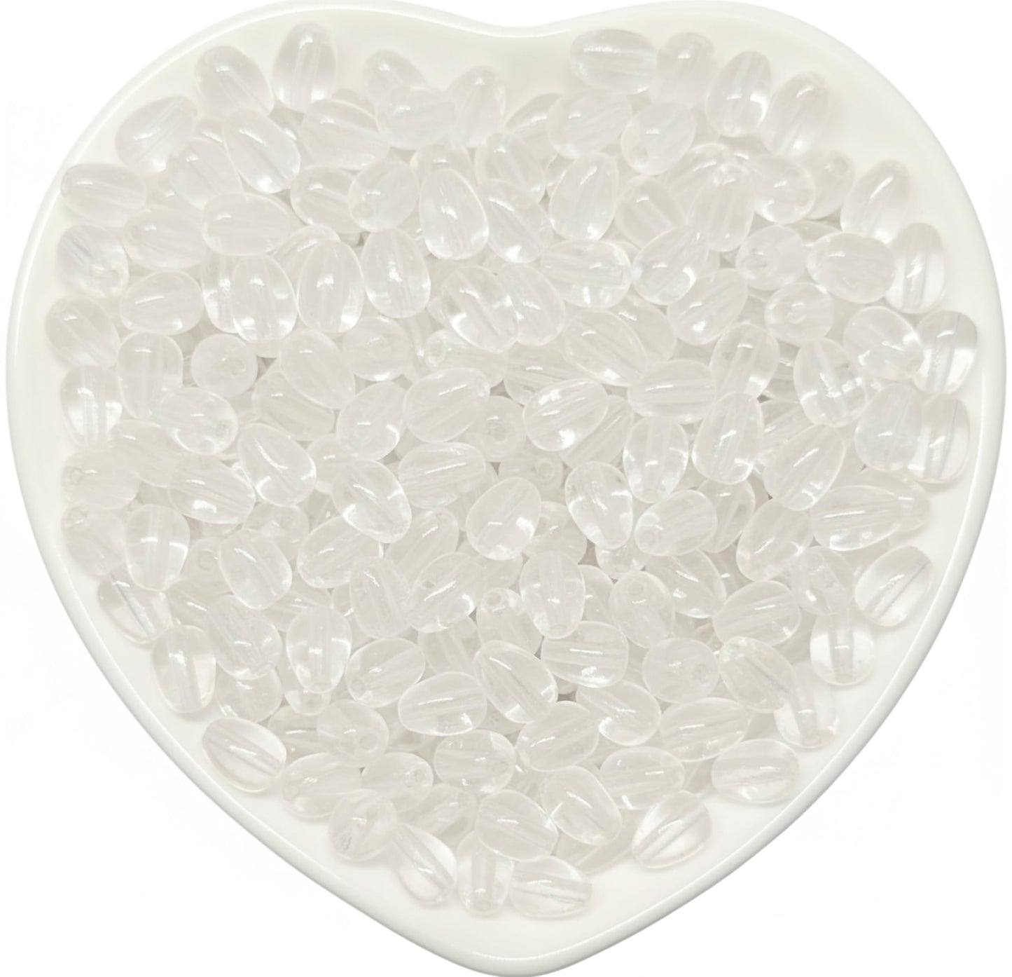 These 8x5mm white glossy teardrop bead accents bring clean bead detail to bracelet making and saree kuchu work.