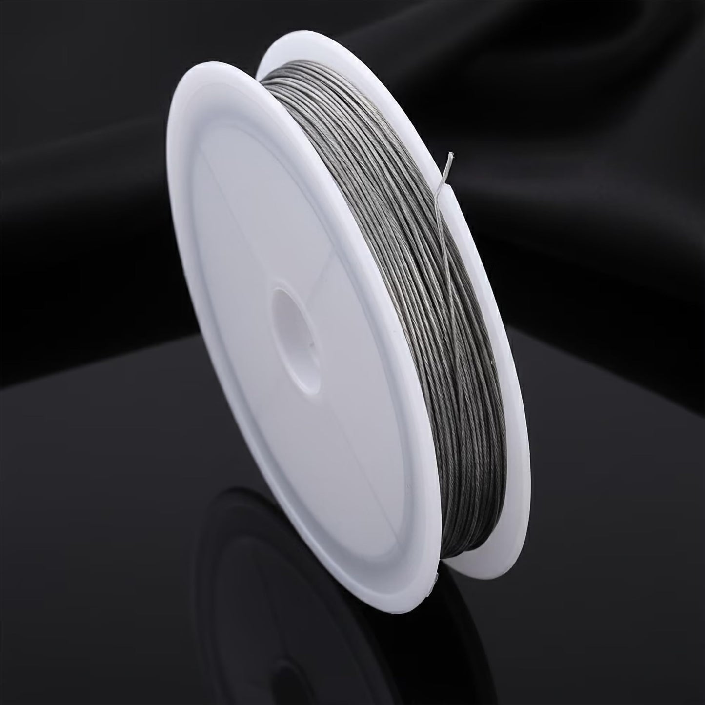 Give necklace designs a handmade touch with silver craft wire spools for bead stringing.