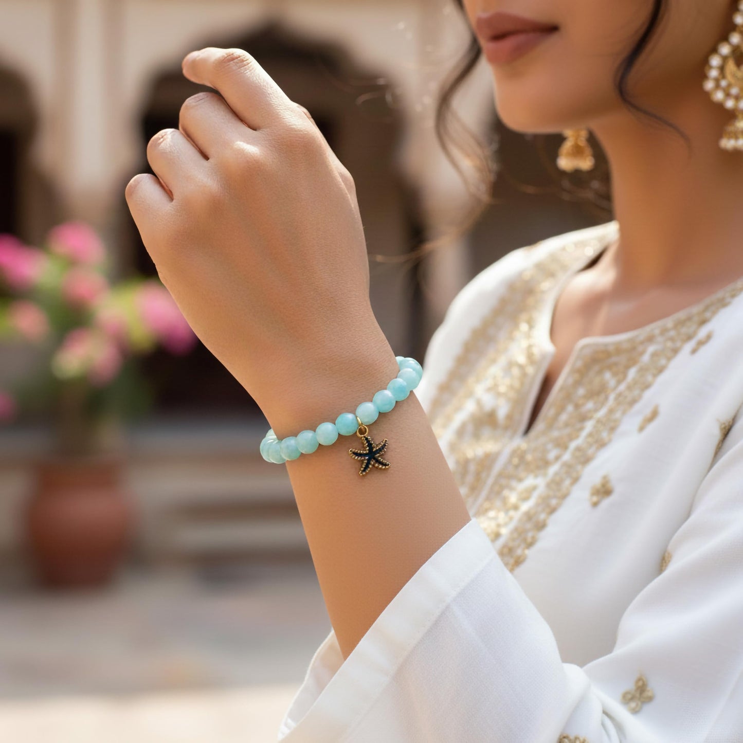 Create a playful accessory look using sky blue dualtone beads and cute bracelet charms.