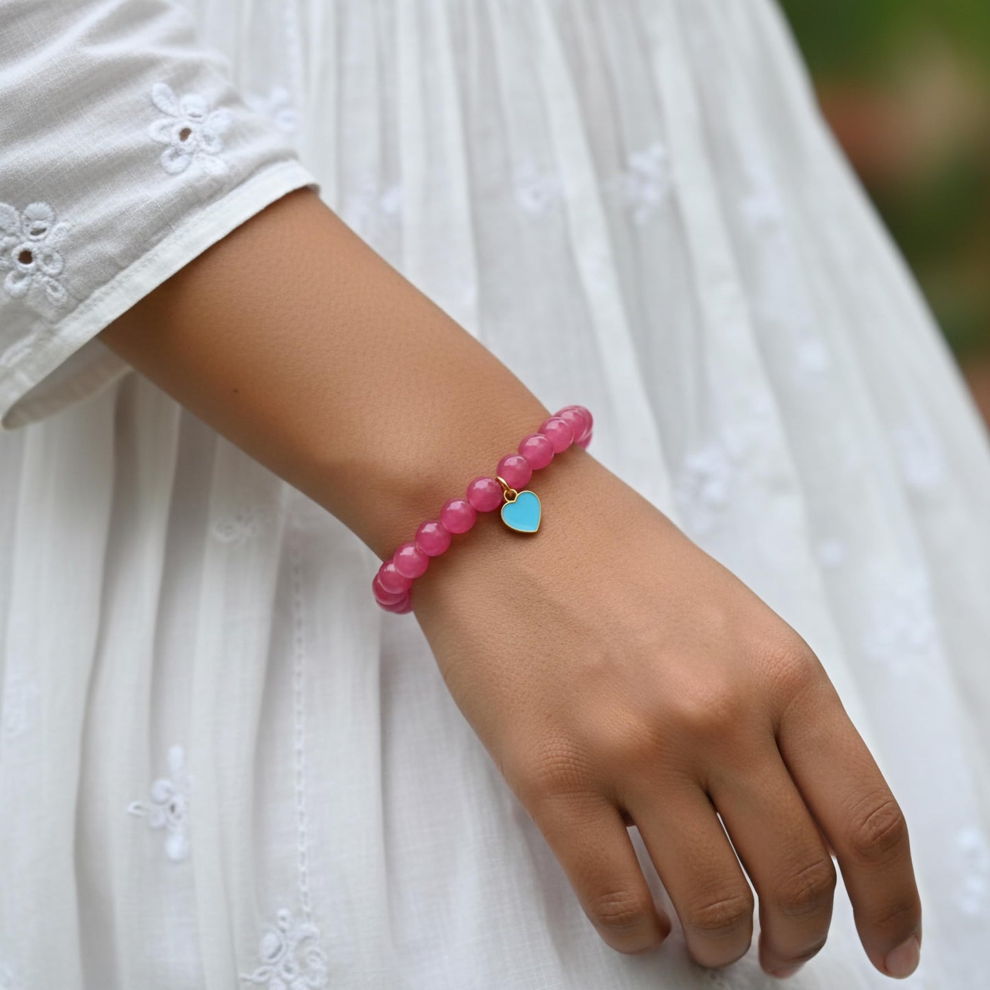 Make daily styling brighter with a ruby bead bracelet that feels simple and fun.
