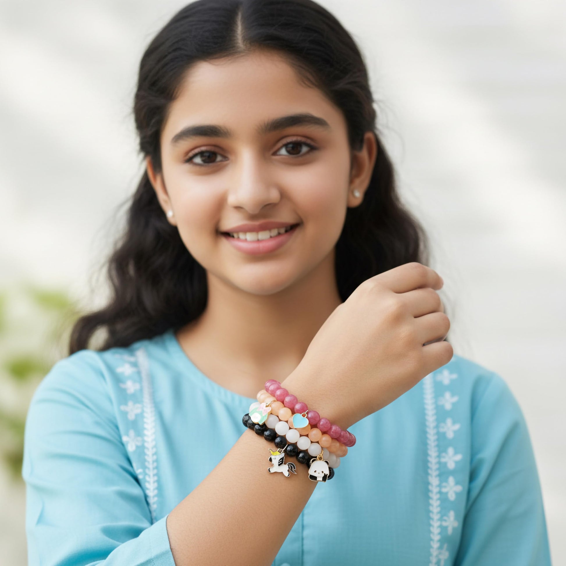 Create easy everyday accessory looks with a 4-pack stretch bracelet set featuring glossy beads.