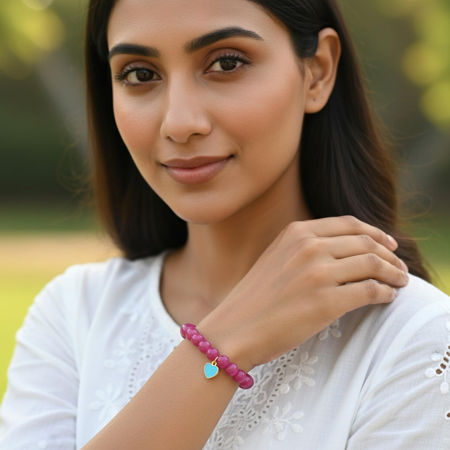 Create easy everyday accessory looks using a ruby stretch bracelet with glossy beads.