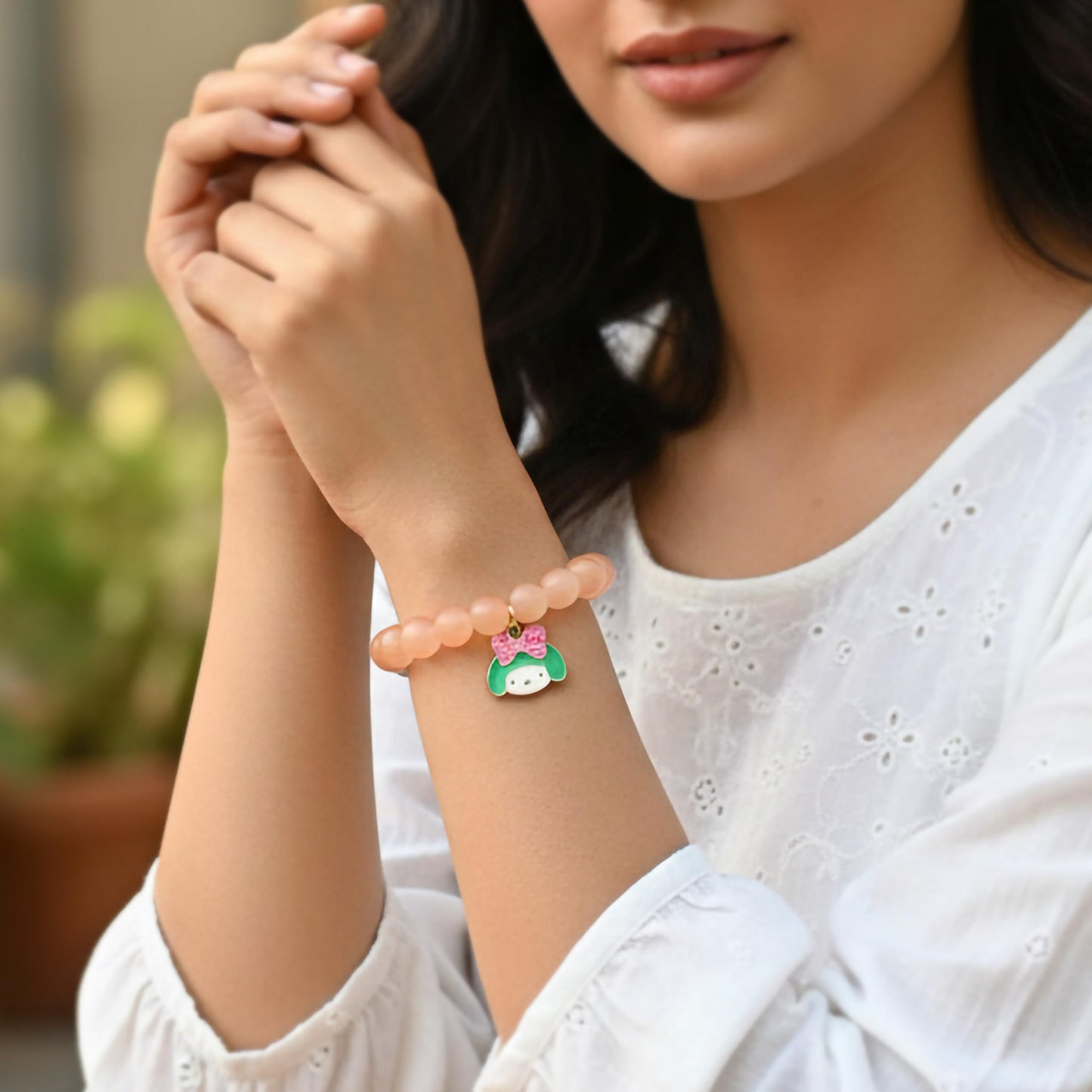 Make daily styling brighter with a peach bead bracelet that feels simple and fun.