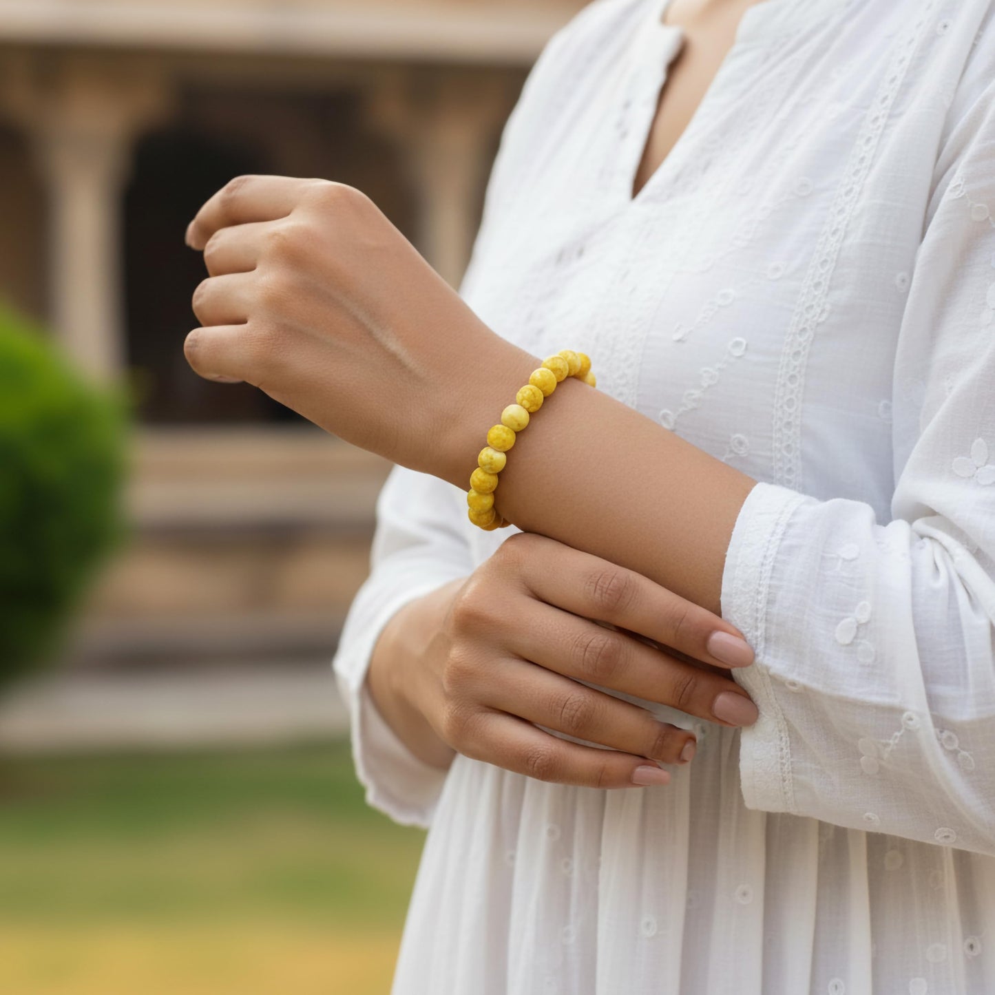 Style everyday outfits with a yellow bead bracelet that feels cute, light and easy to layer.