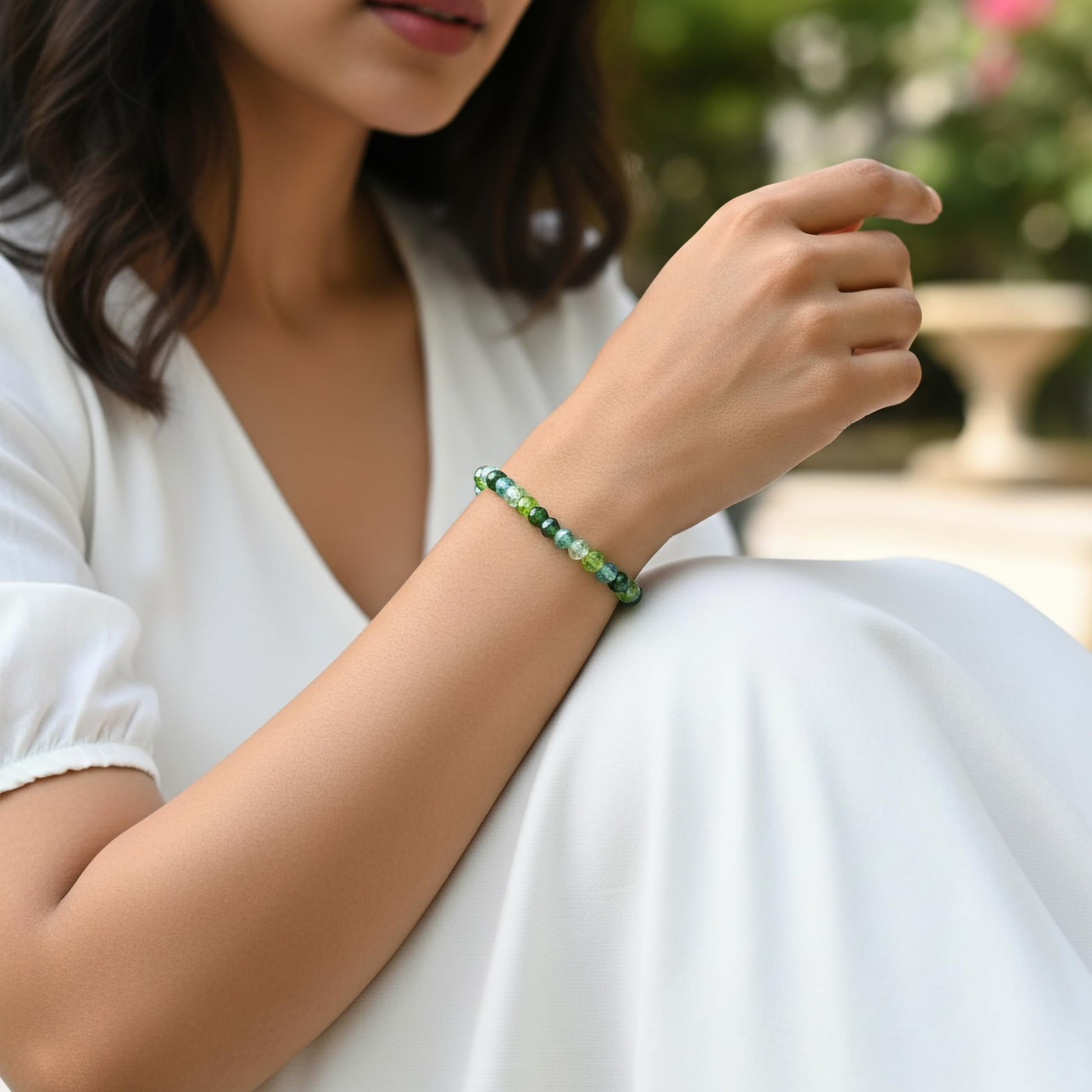 Create a bright friendship accessory look using green bicone beads and stretch bracelet styling.