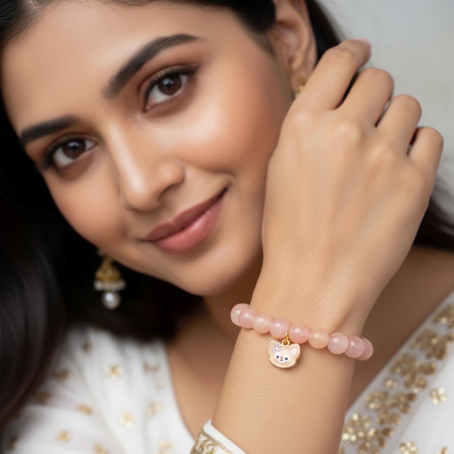 Create a playful accessory look using peach dualtone beads and cute bracelet charms.