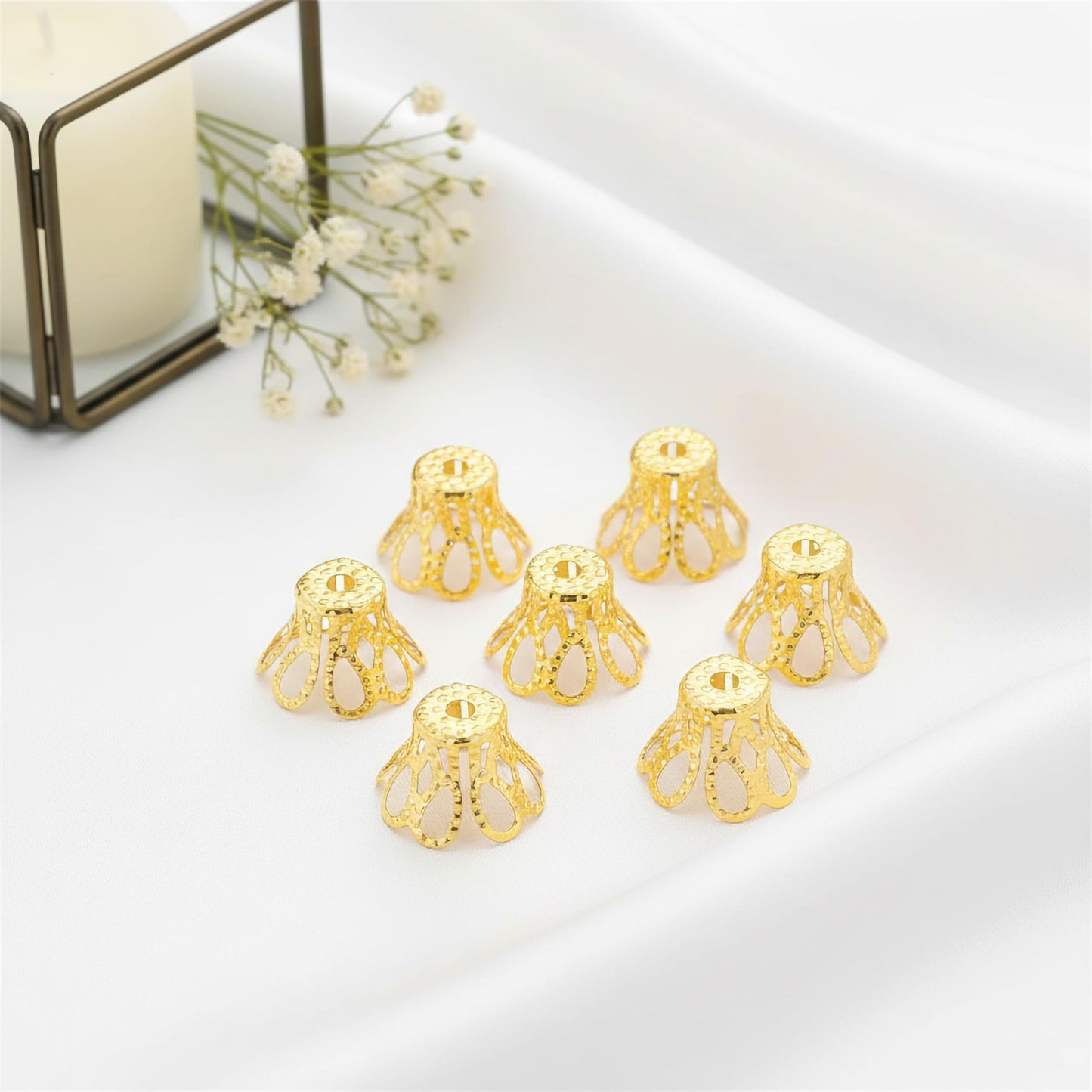 Use these golden jewelry caps to make saree kuchu craft feel more finished.