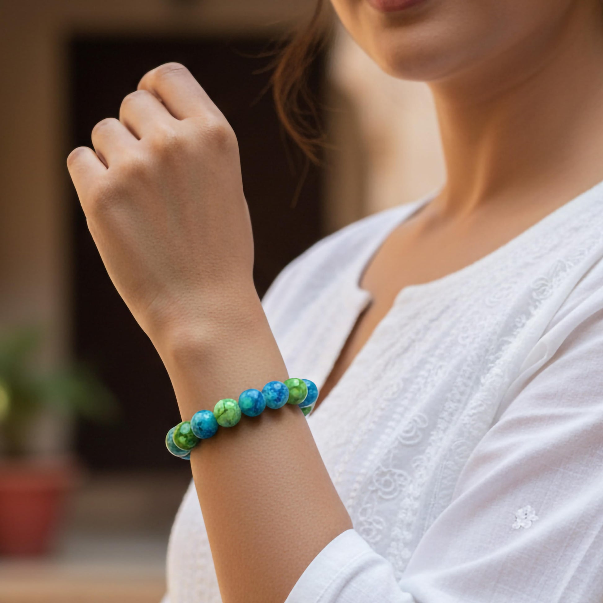 Style everyday outfits with a green and blue bead bracelet that feels cute, light and easy to layer.