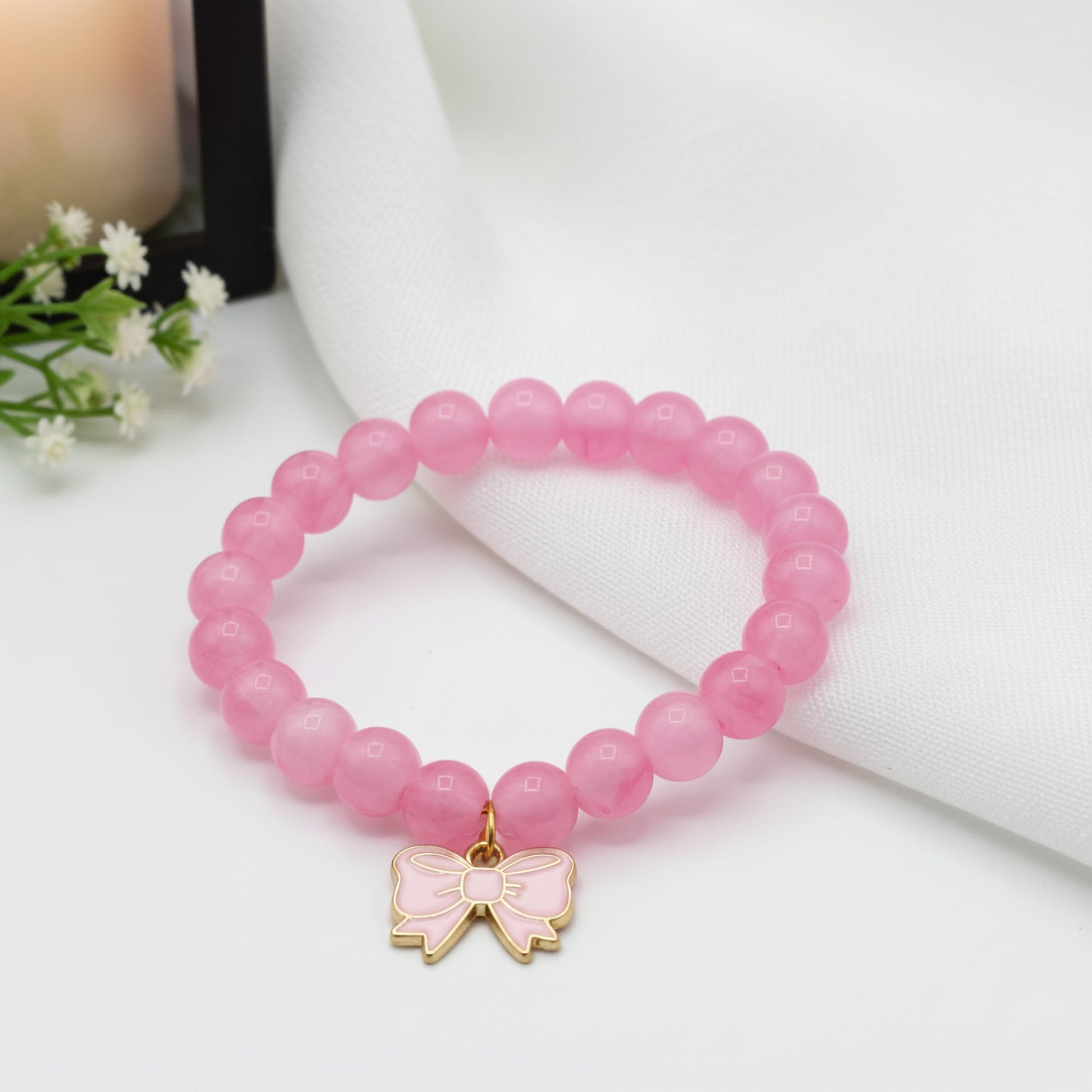 Gift a light and cheerful bracelet style with pink beads and comfortable elastic wear.