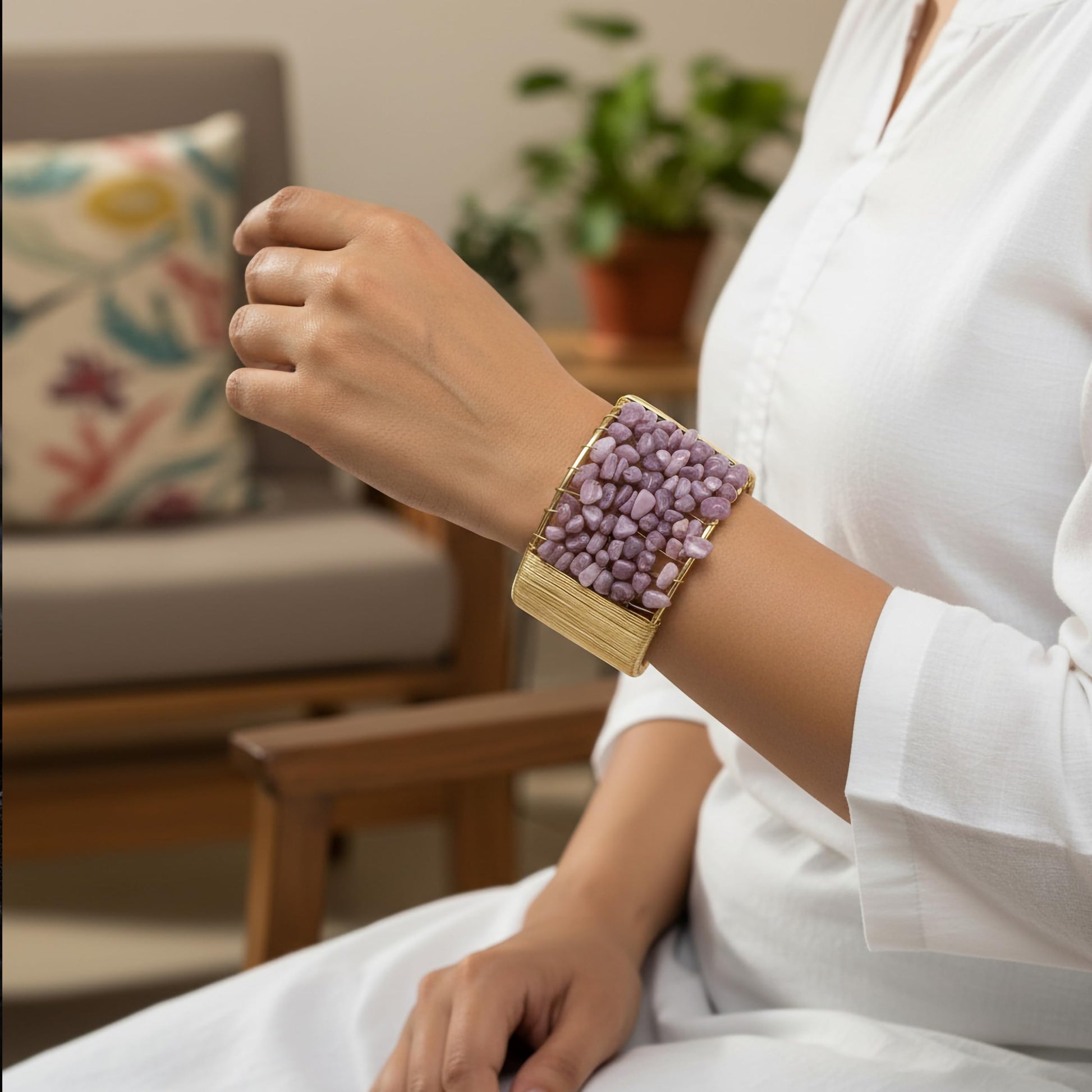 Layer outfits with a textured lavender stone chip bracelet for a strong modern finish.