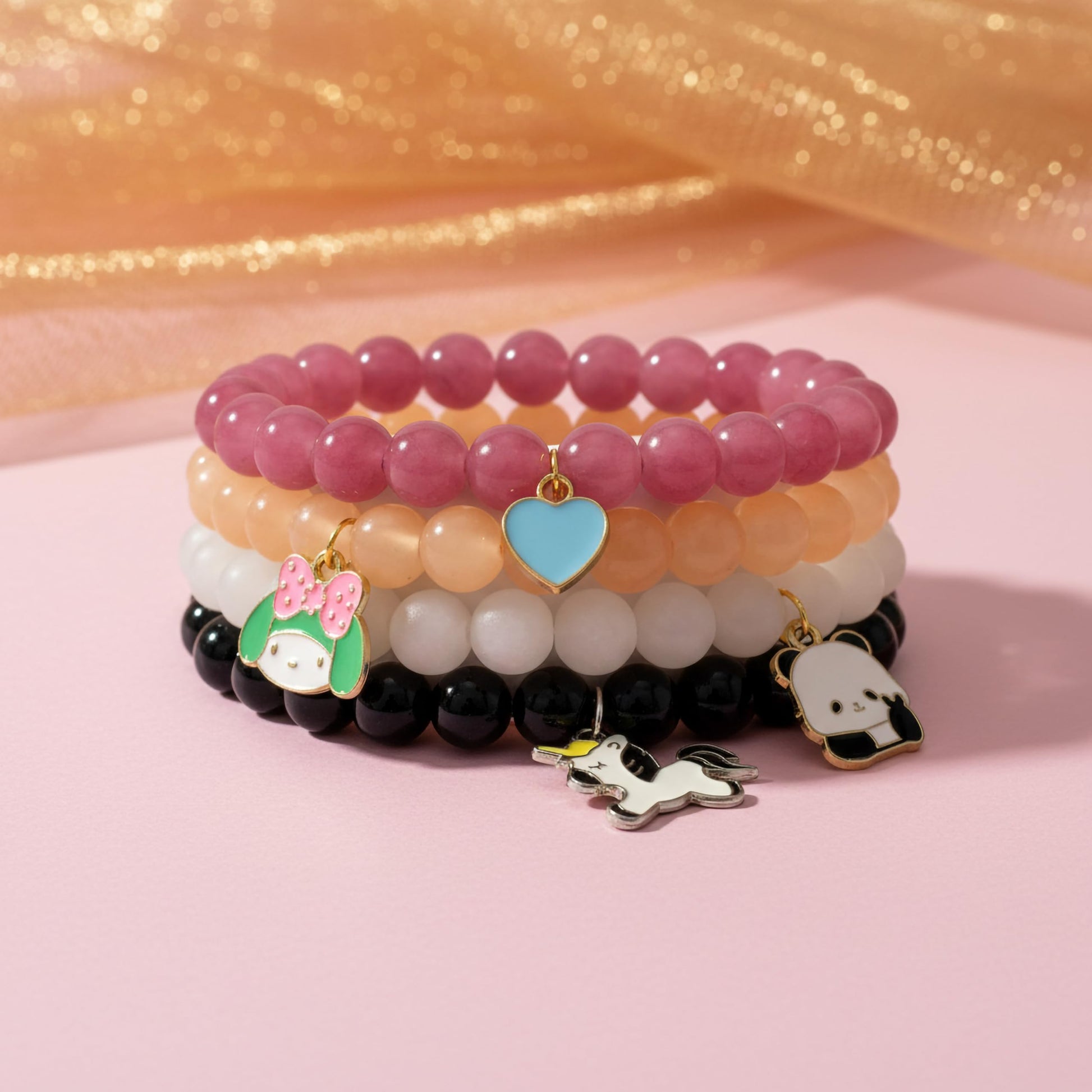 Bring cute charm detail to casual outfits with a 4-pack beaded bracelet set for girls and women.