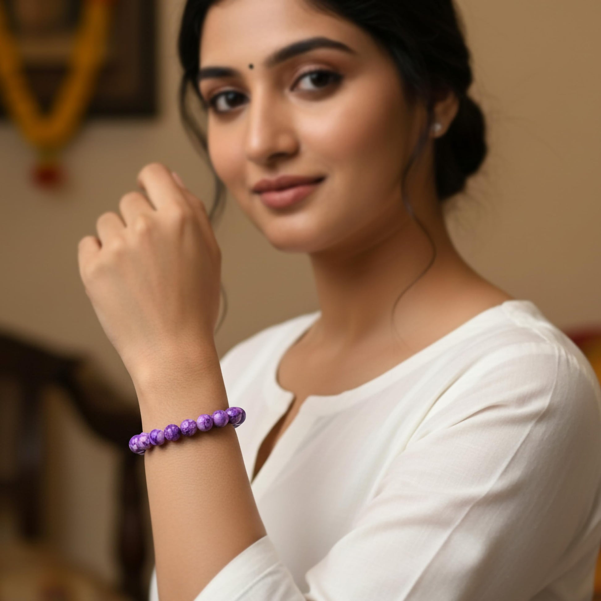 Create a fresh friendship-band look using purple marble beads and easy stretch styling.