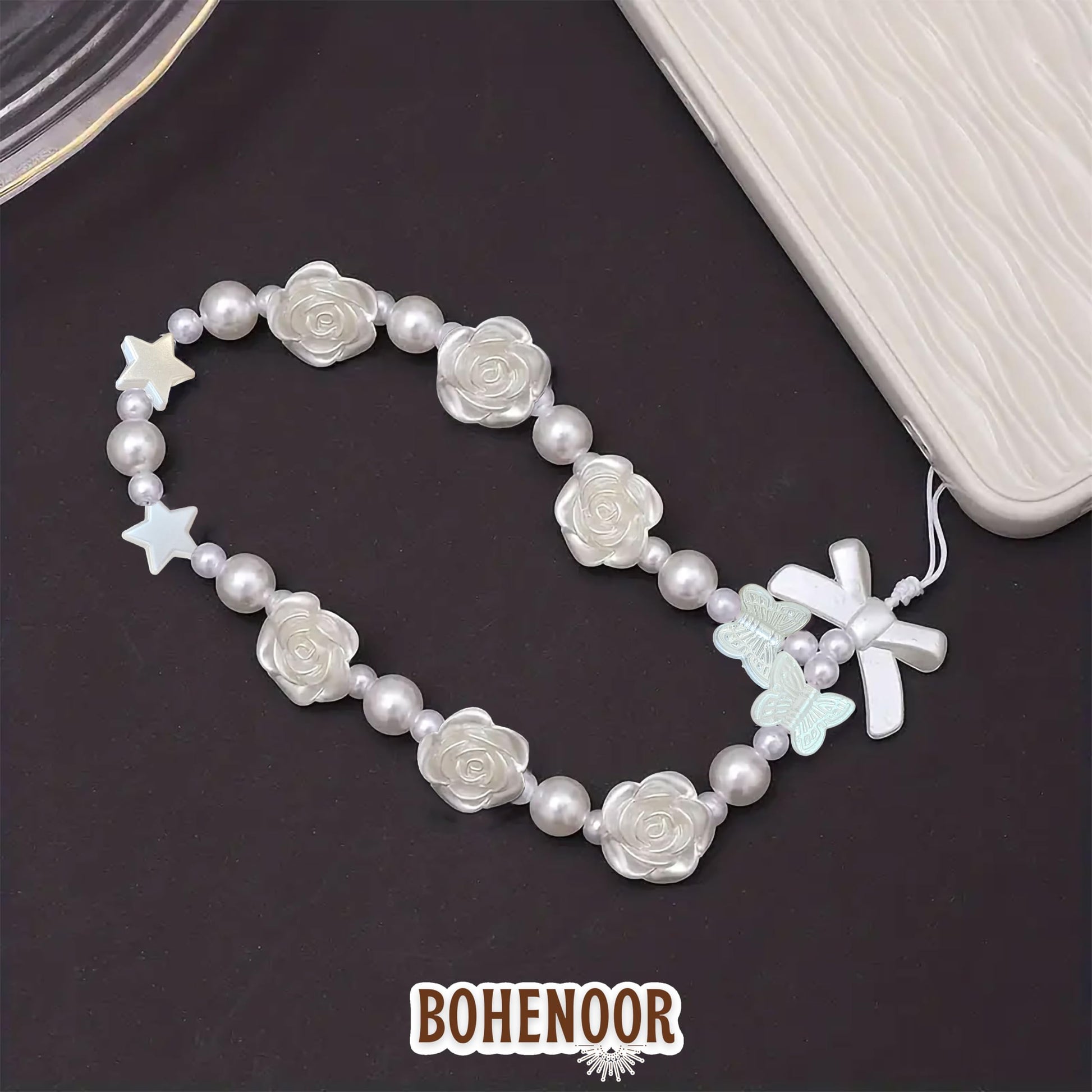 White Cell Phone Mobile Strap with Crystal Beads. Assorted layout image showing beads organized for bracelet and DIY projects.