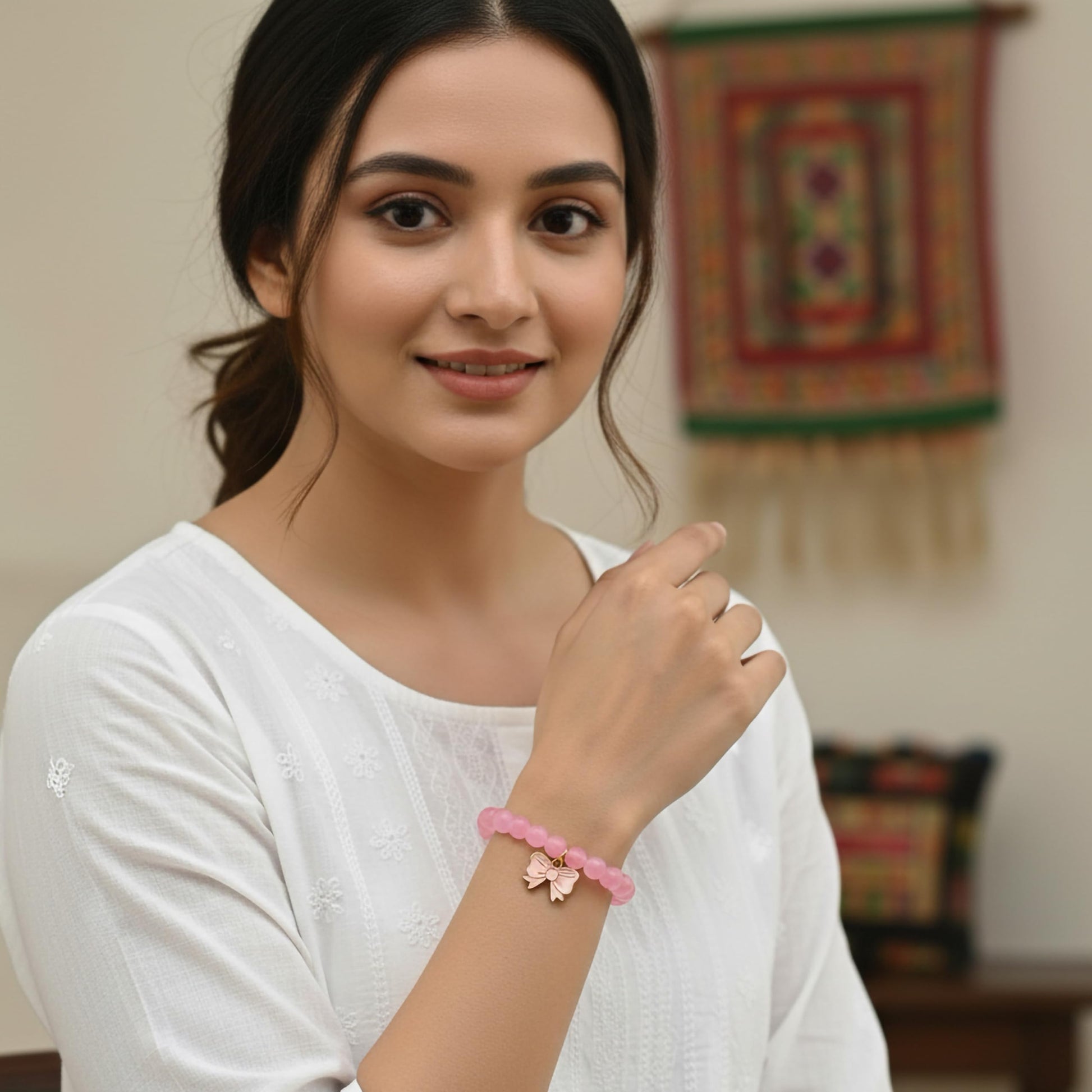 Make daily styling brighter with a pink bead bracelet that feels simple and fun.