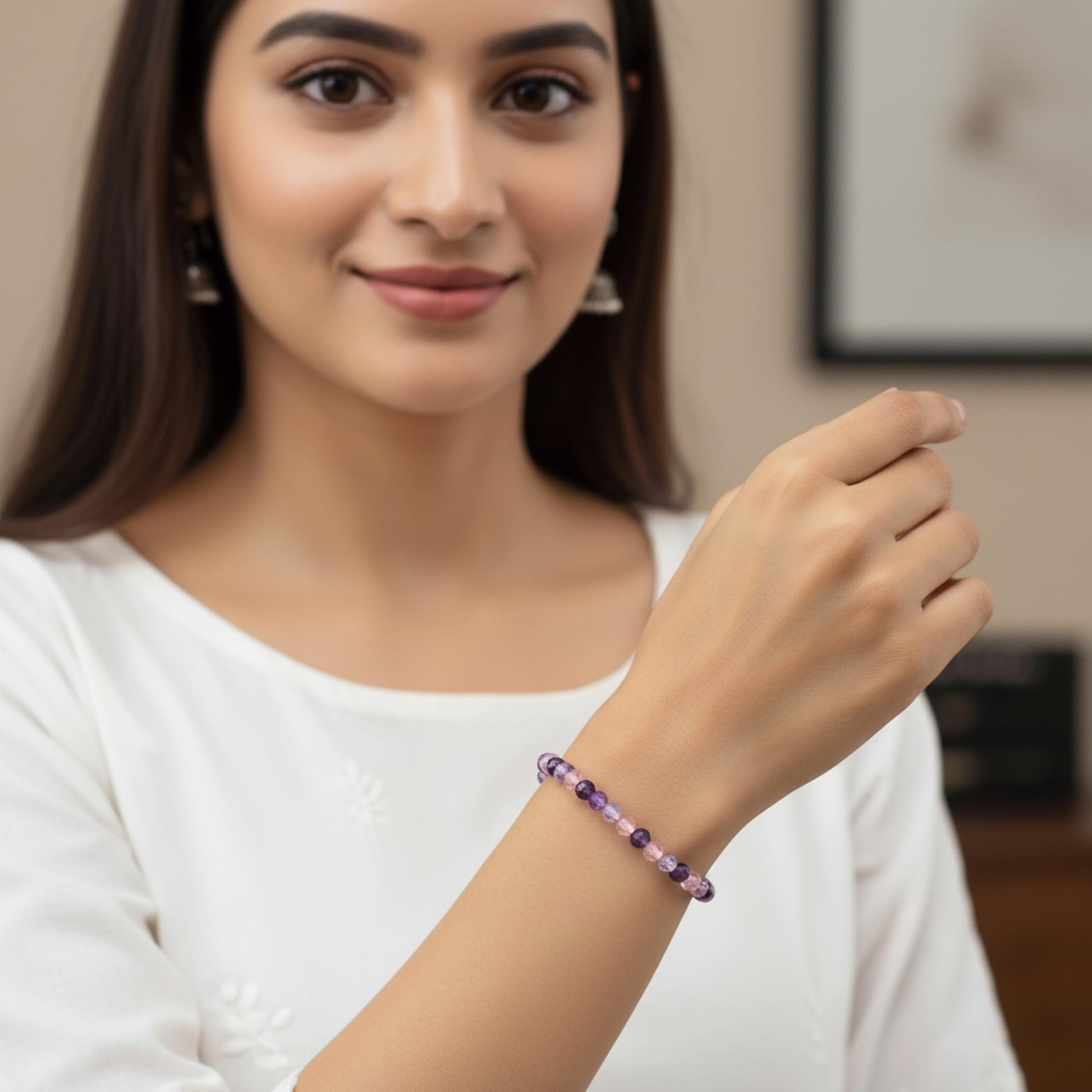 Create a bright friendship accessory look using purple bicone beads and stretch bracelet styling.