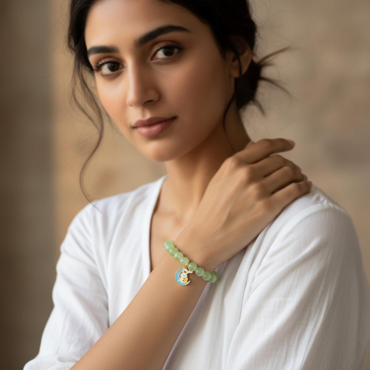 Create easy everyday accessory looks using a green stretch bracelet with glossy beads.