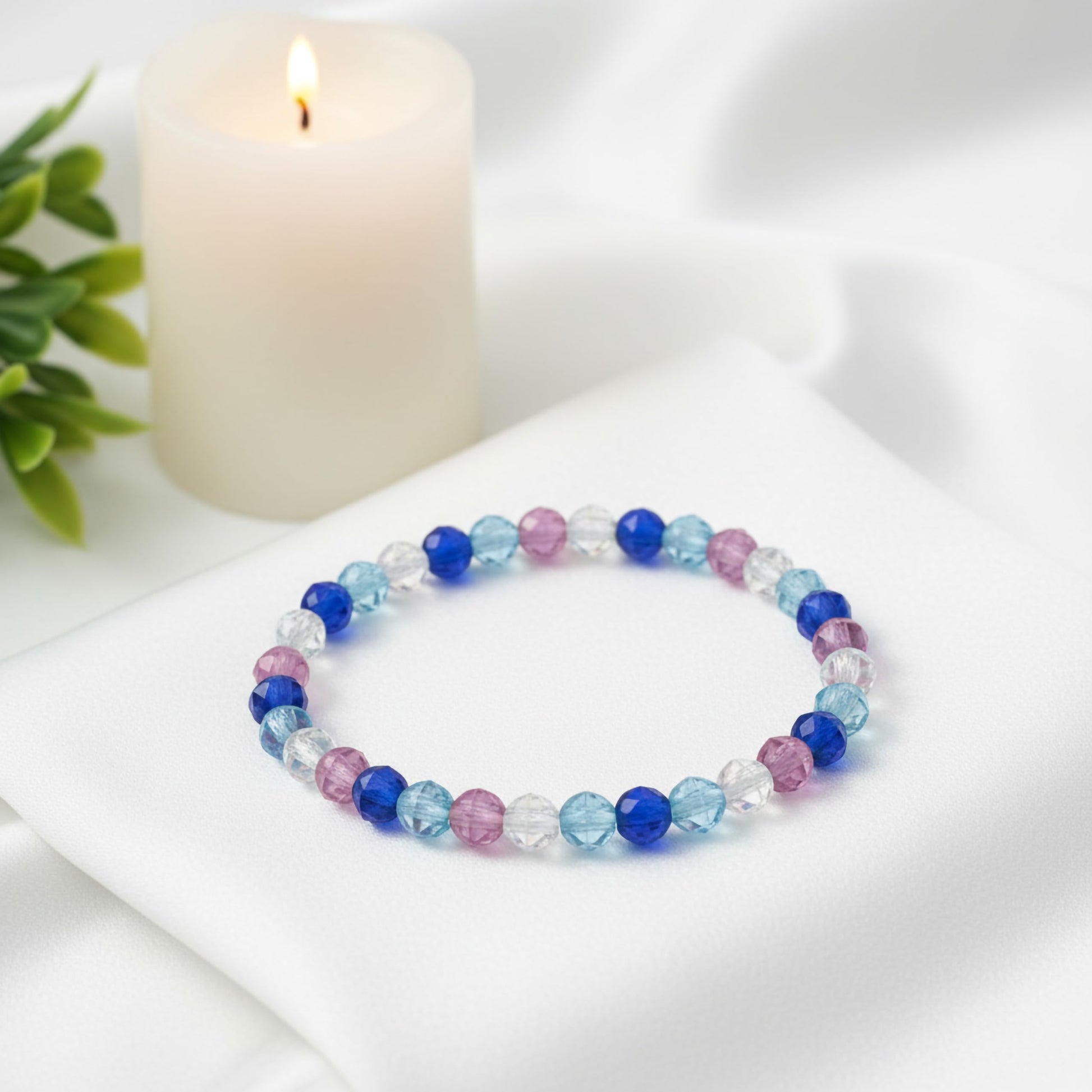 Bring a polished bead finish to casual outfits with a blue faceted bracelet set.