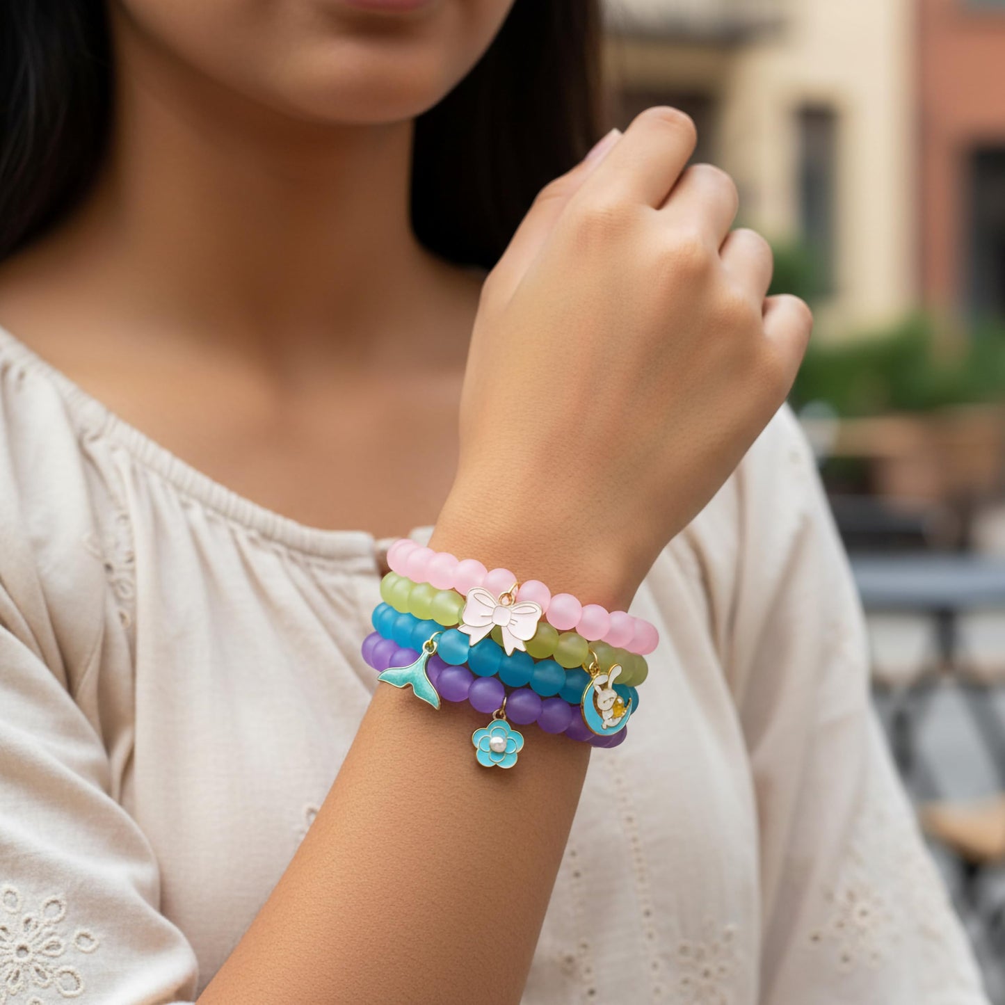 Create easy everyday accessory looks with a 4-piece stretch bracelet set featuring glossy beads.