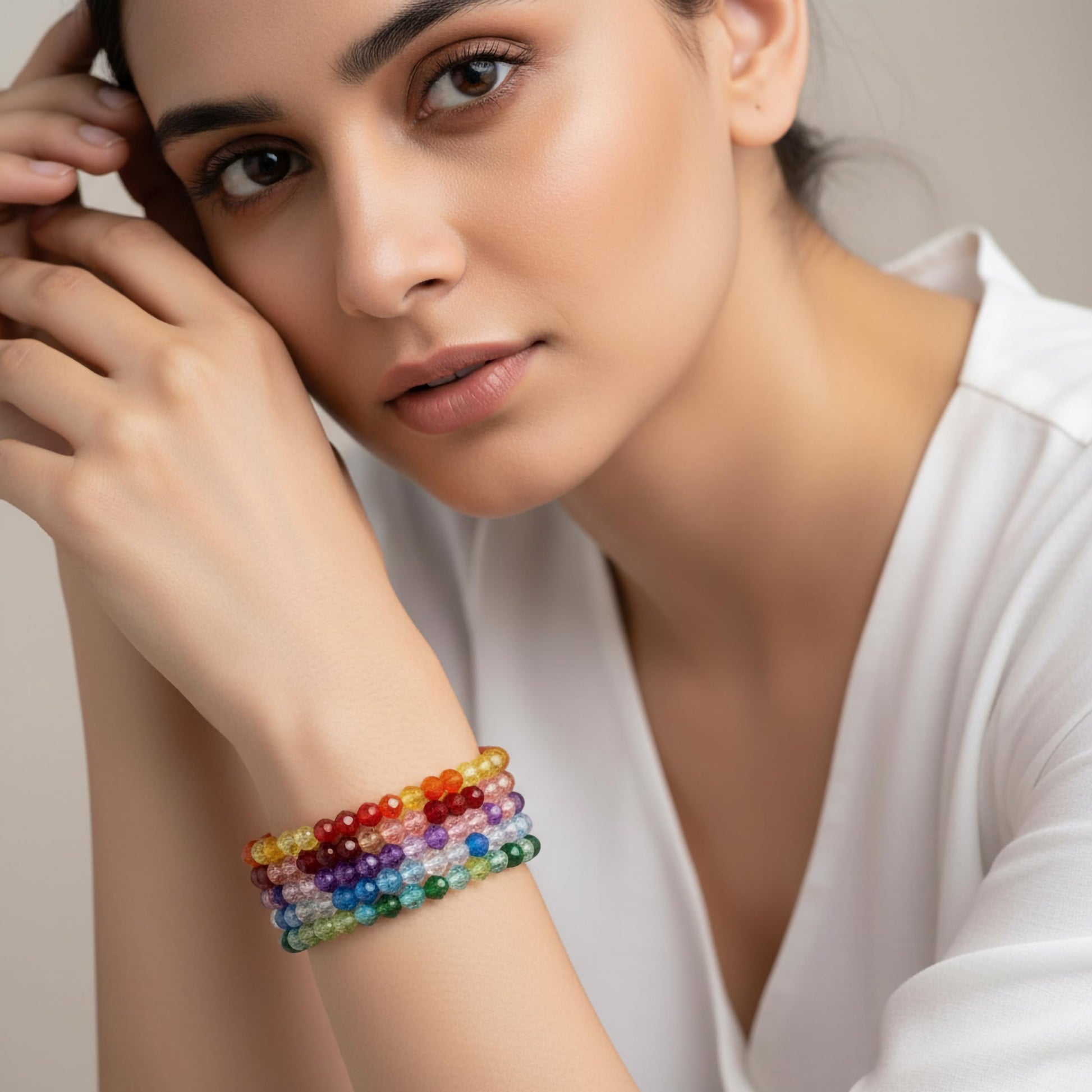 Create a bright friendship accessory look using multicolor bicone beads and stretch bracelet styling.