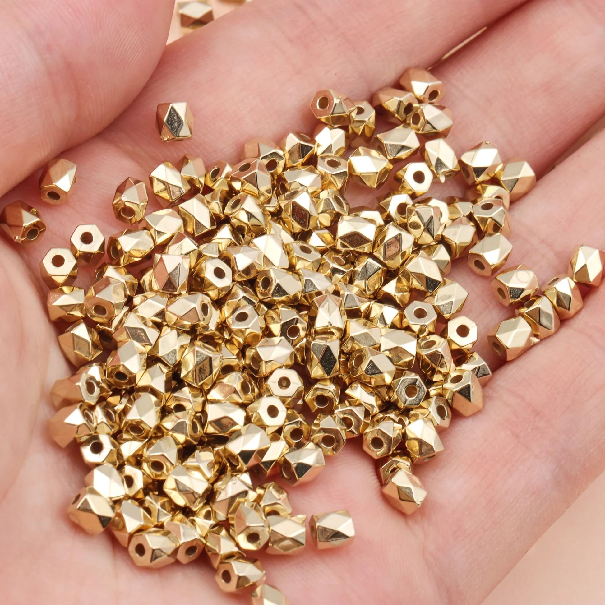 Drum gold and silver plastic and acrylic beads help add a handmade beadwork accent to handmade projects to necklace making and DIY jewellery projects.
