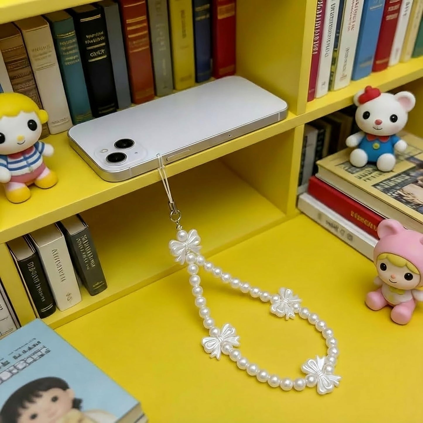White Cell Phone Mobile Strap with Crystal Beads and Pearls. Assorted layout image showing beads organized for bracelet and DIY projects.