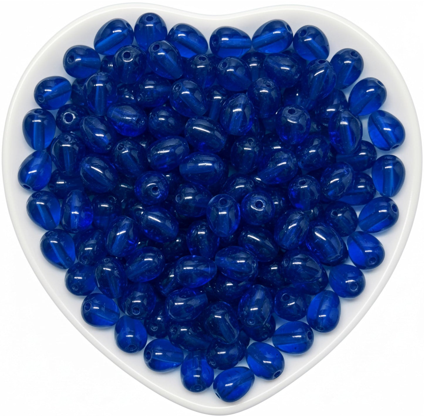 Add glossy teardrop accents to bracelets and earrings with 10x6mm blue glass beads.