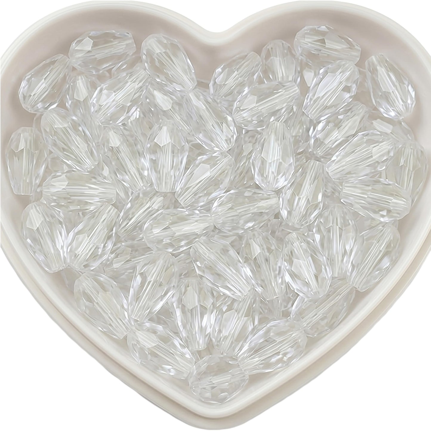 Add graceful dangle accents to earrings and charms with 10x6mm white faceted teardrop beads.