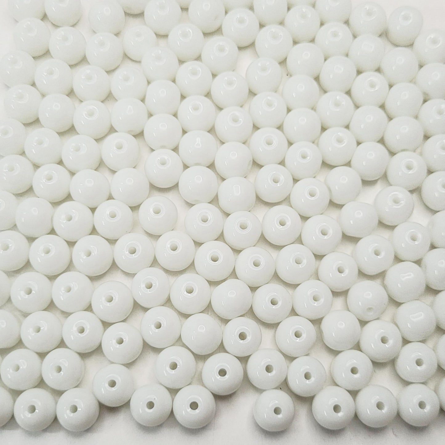 Necklace making benefits from white and transparent 3mm,4mm,6mm,8mm beads and decorative beading finish.