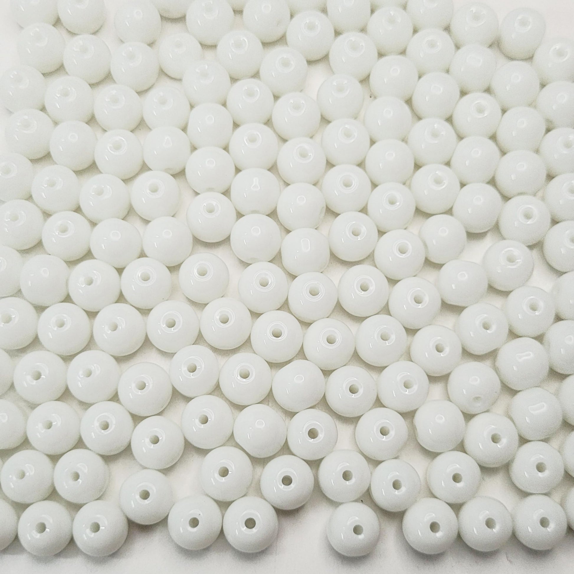 Necklace making benefits from white and transparent 3mm,4mm,6mm,8mm beads and decorative beading finish.