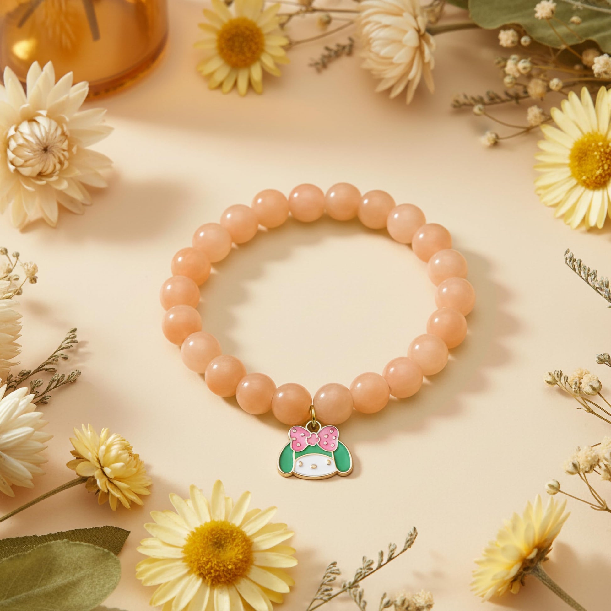 Bring cute charm detail to casual outfits with a peach beaded bracelet for girls and women.