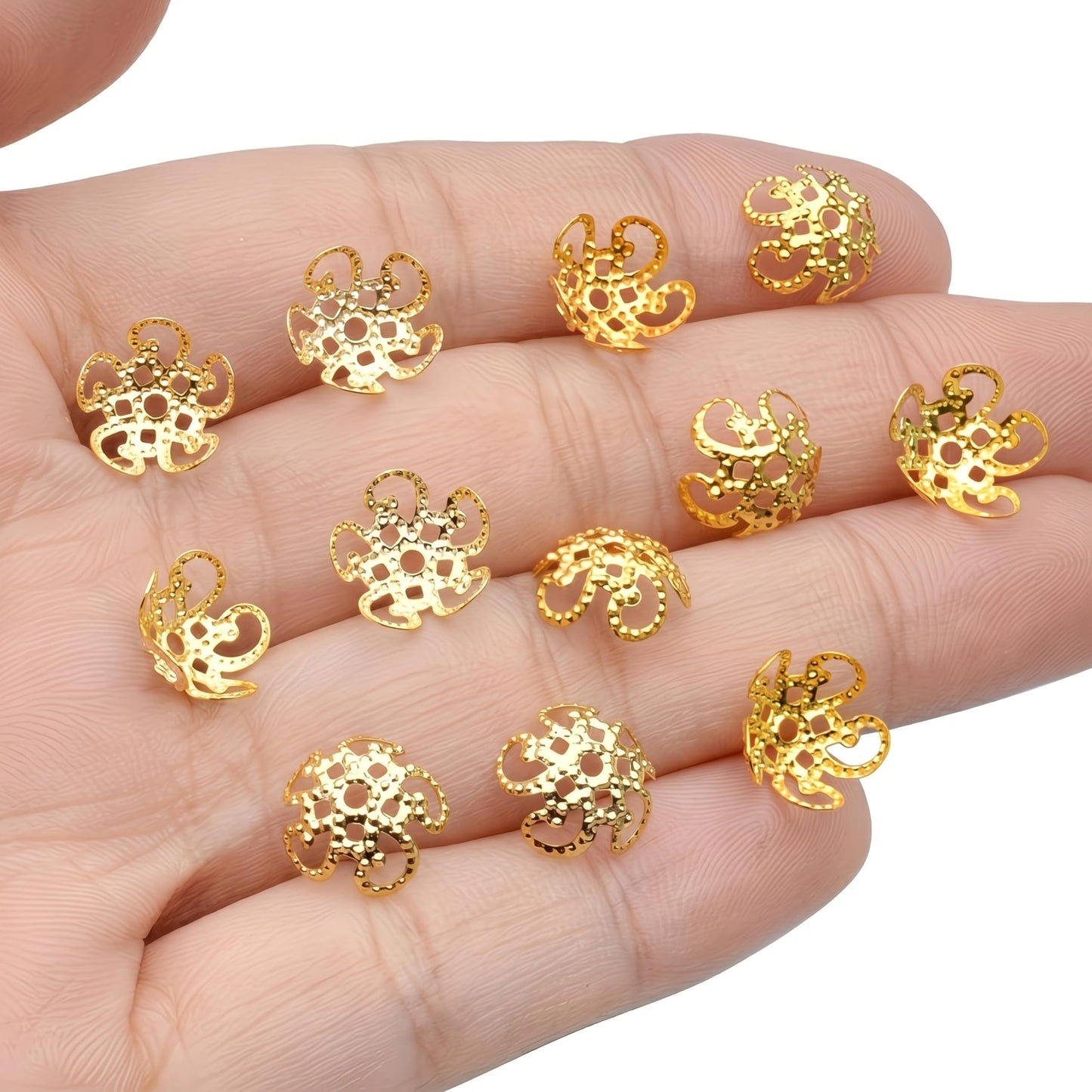 Build saree kuchu craft and jhumka making around ornate gold flower bead caps.