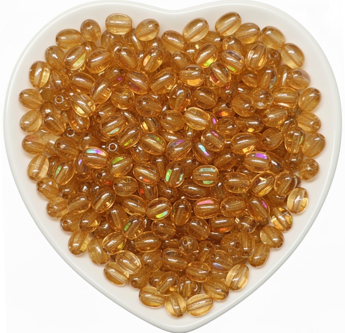 Add sparkle to latkan designs and DIY jewelry projects with 8x5mm rainbow shine transparent assorted drop beads.