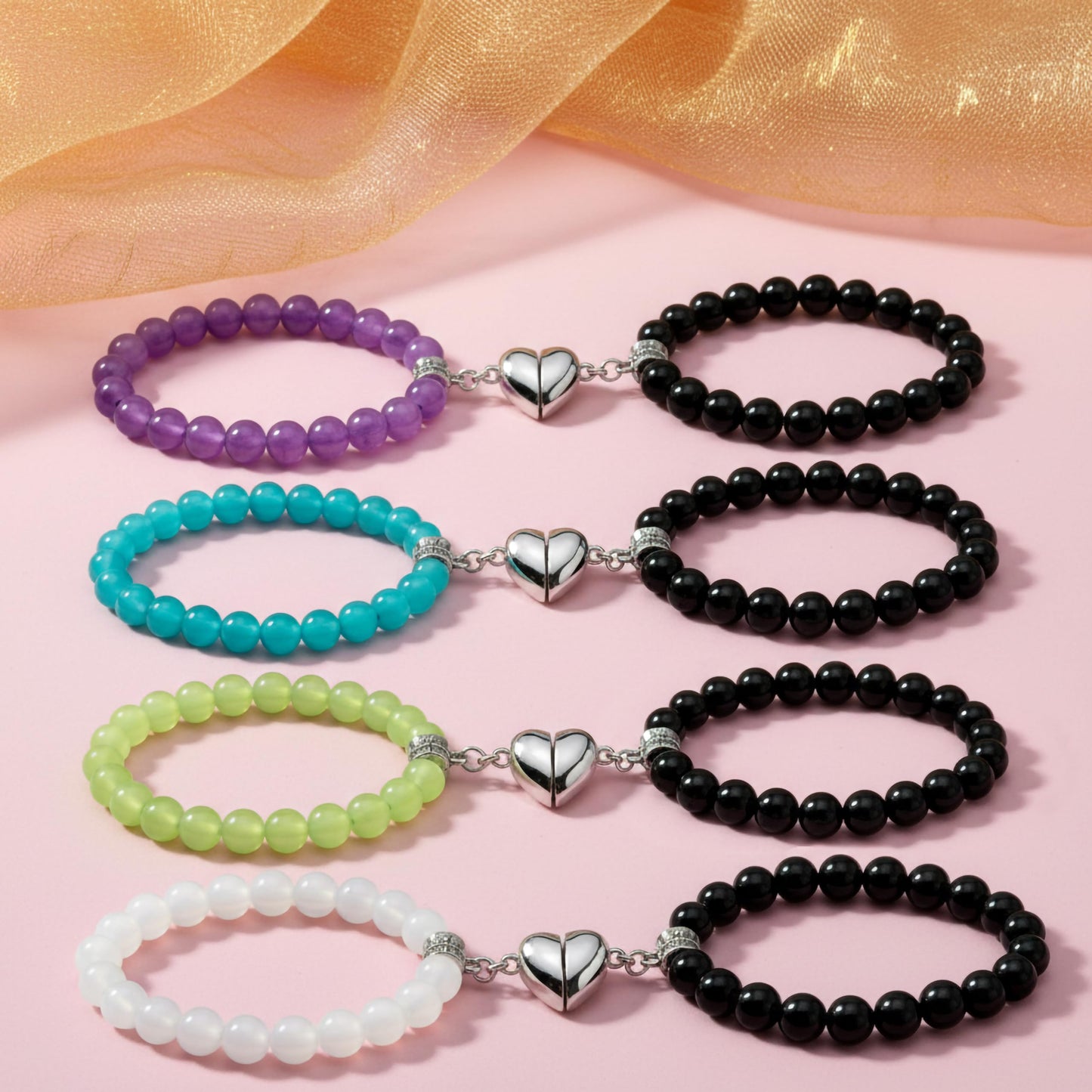 Create a sweet paired wrist look using 5-pair cord bracelets with connecting heart charms.