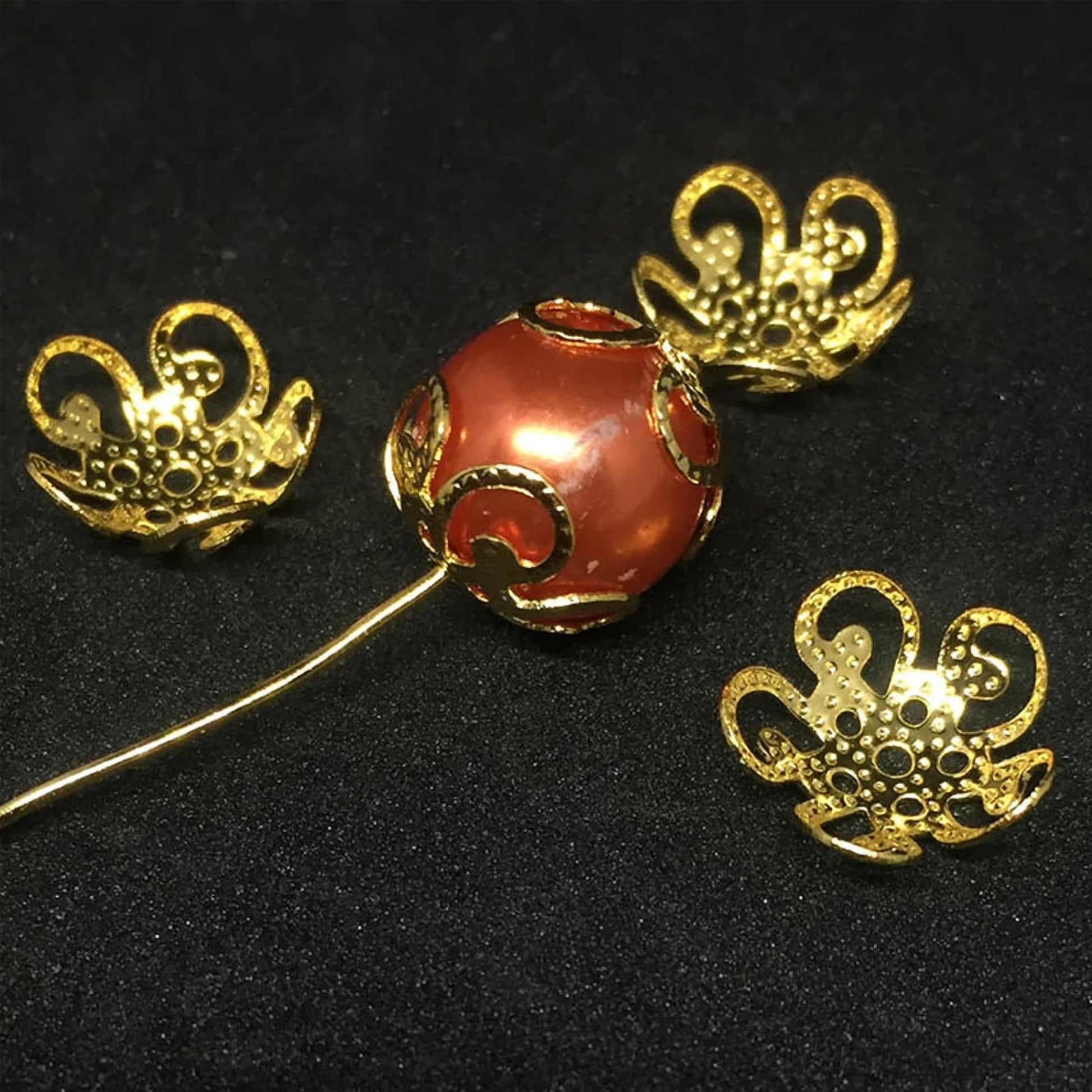 These jewelry-ready golden jewelry caps bring neat finishing detail to bead jewelry and saree kuchu craft.
