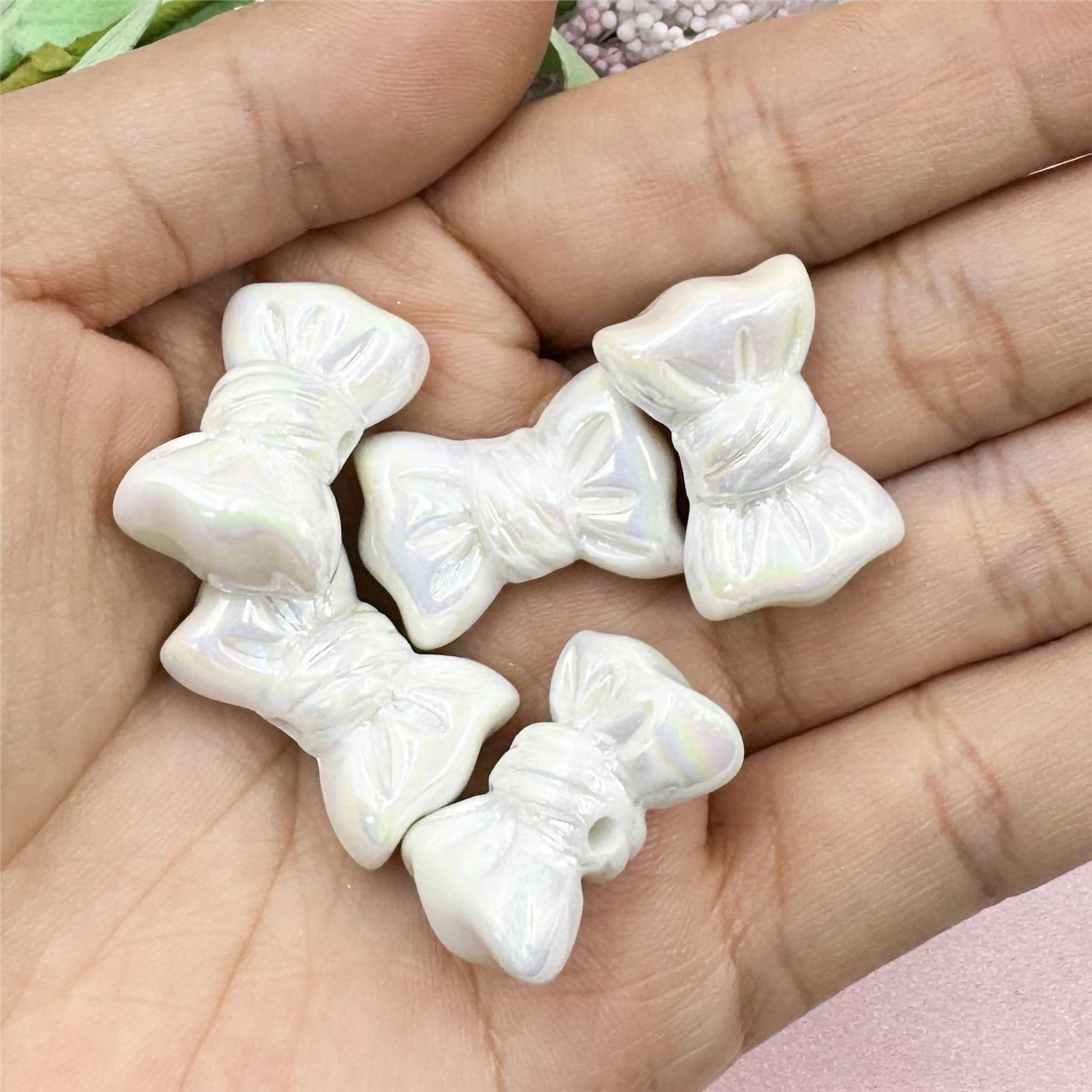 White DIY Phone Charm Making Kit with Beads and Charms. Close-up image showing color, shape, finish, and texture details.