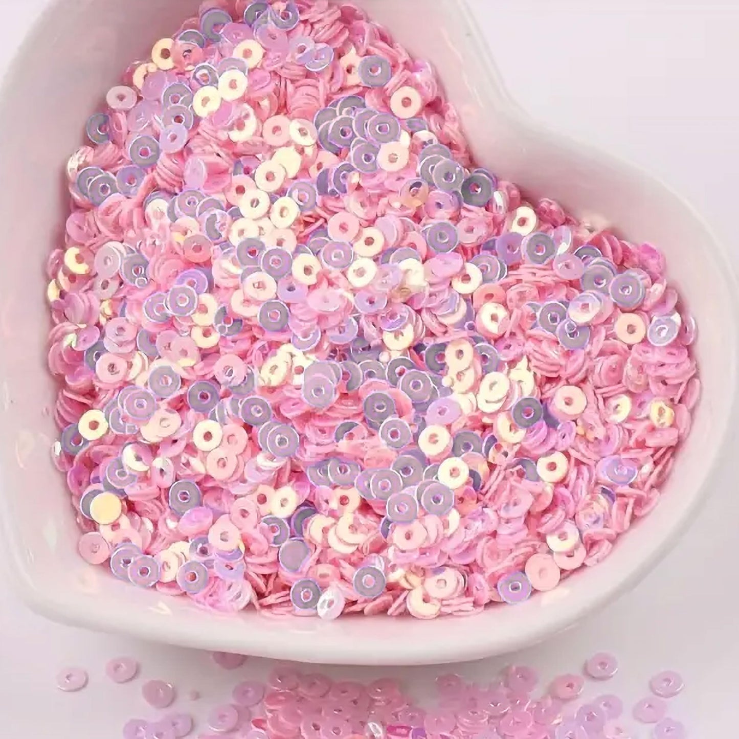 Use light pink 4mm sequins round shape 4mm sitara sequins with holes to give Embroidery for embroidery, craft decoration and fabric embellishment a sparkling look.