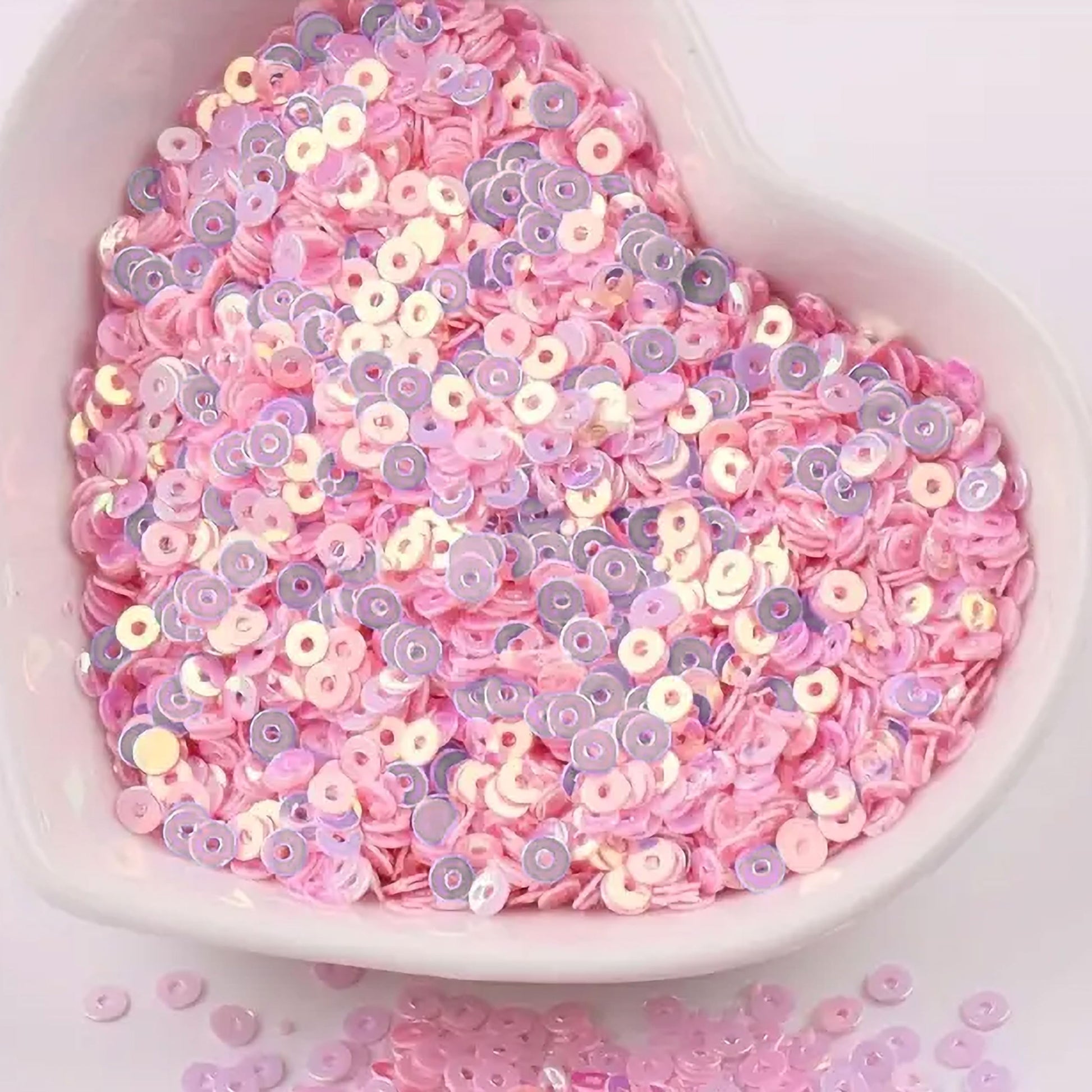 Use light pink 4mm sequins round shape 4mm sitara sequins with holes to give Embroidery for embroidery, craft decoration and fabric embellishment a sparkling look.