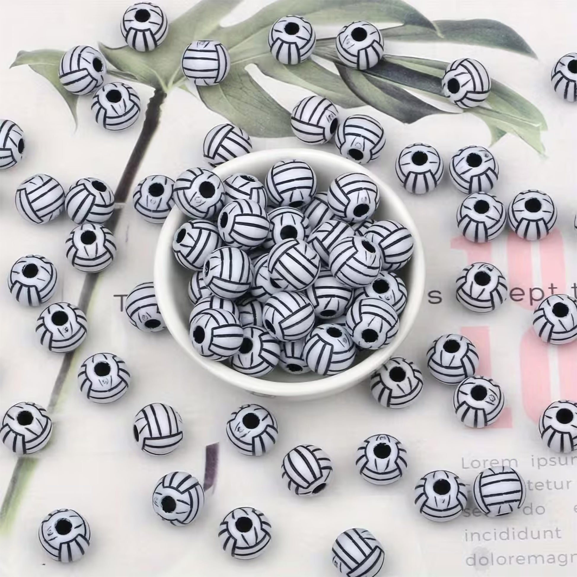 Decorative black beads with white volleyball line detailing