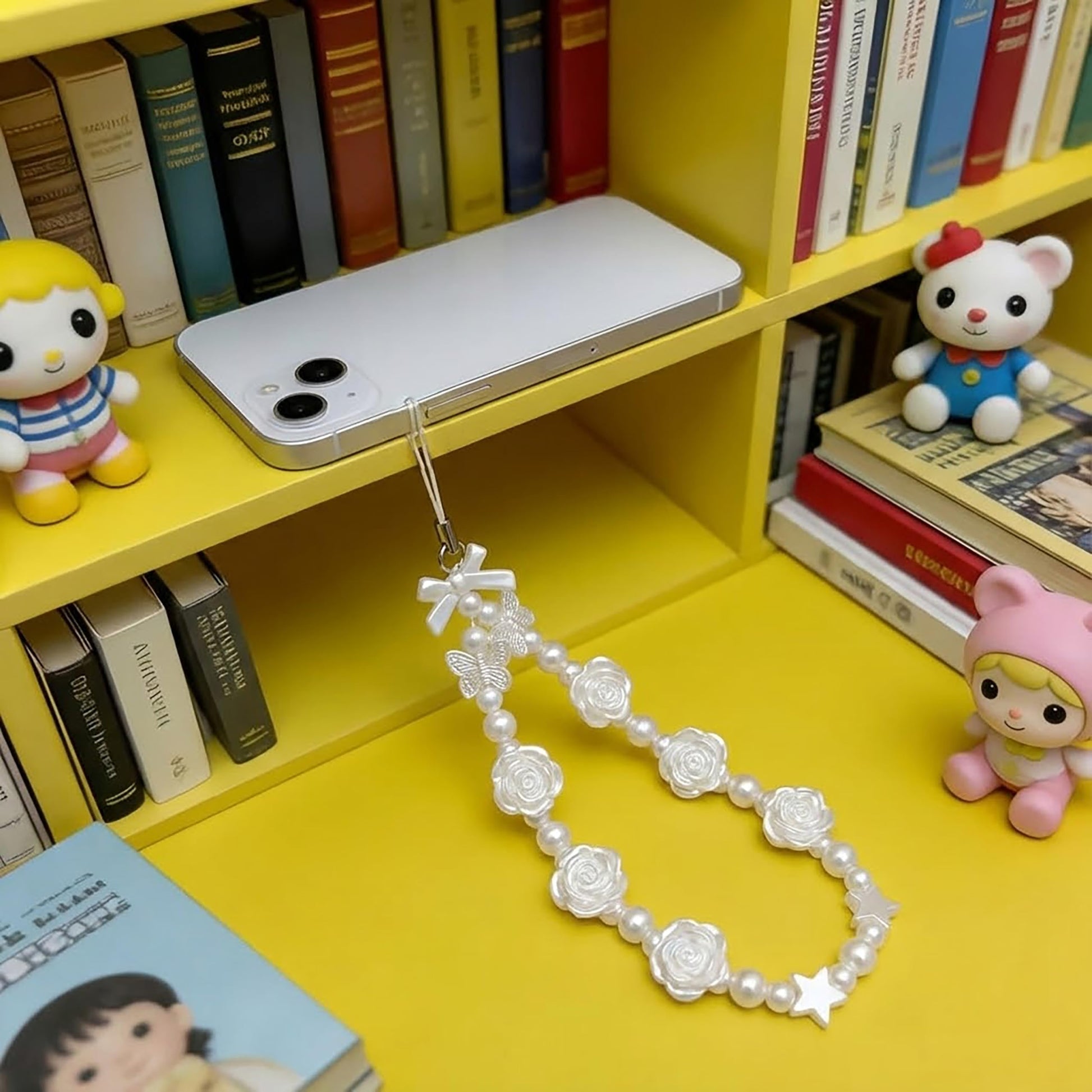White Cell Phone Mobile Strap with Crystal Beads. Detailed product image showing size, surface, and material quality.